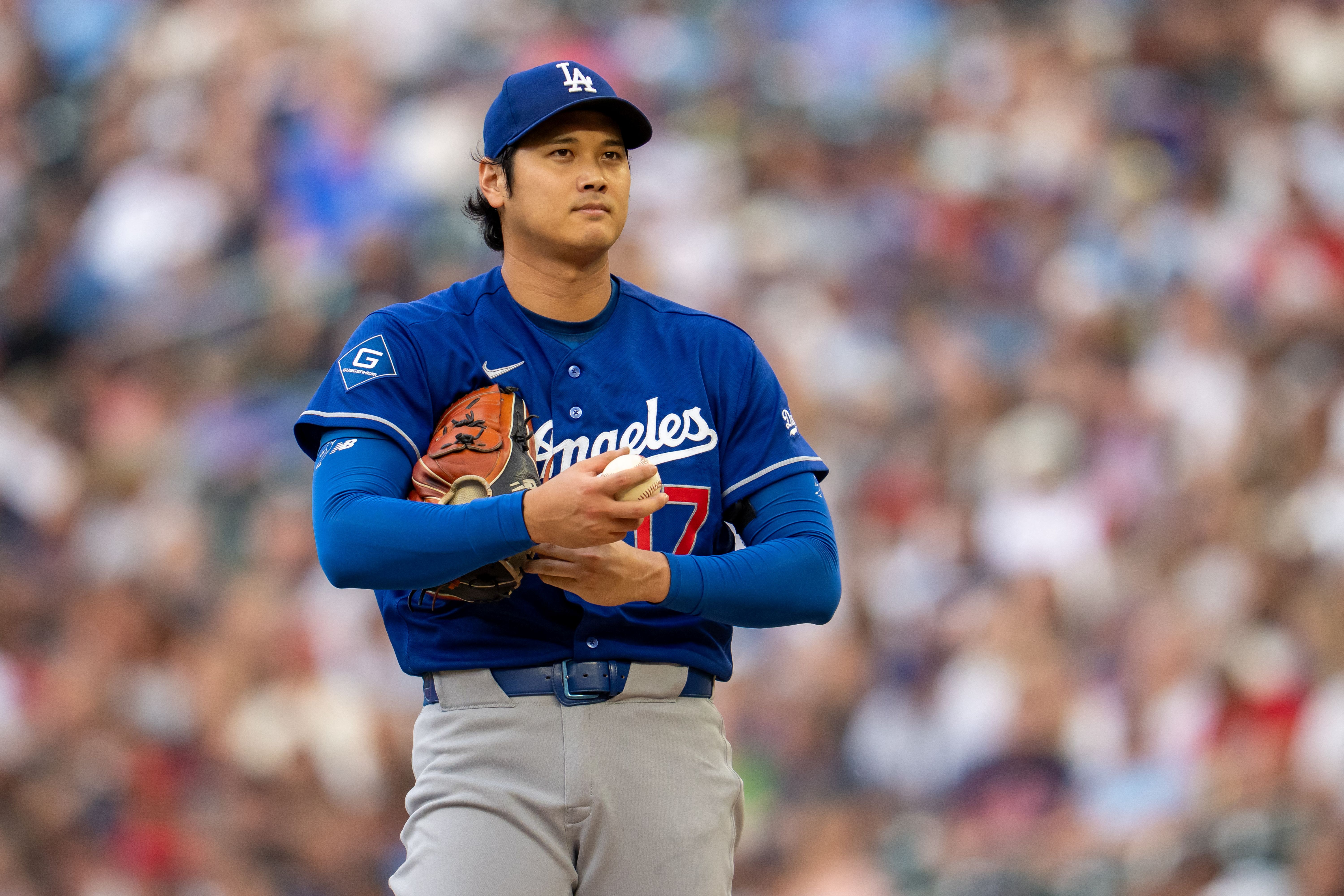 Los Angeles Dodgers starting pitcher Shohei Ohtani looks on before delivering a pitch, and he's key to the Padres vs. Dodgers win probability.