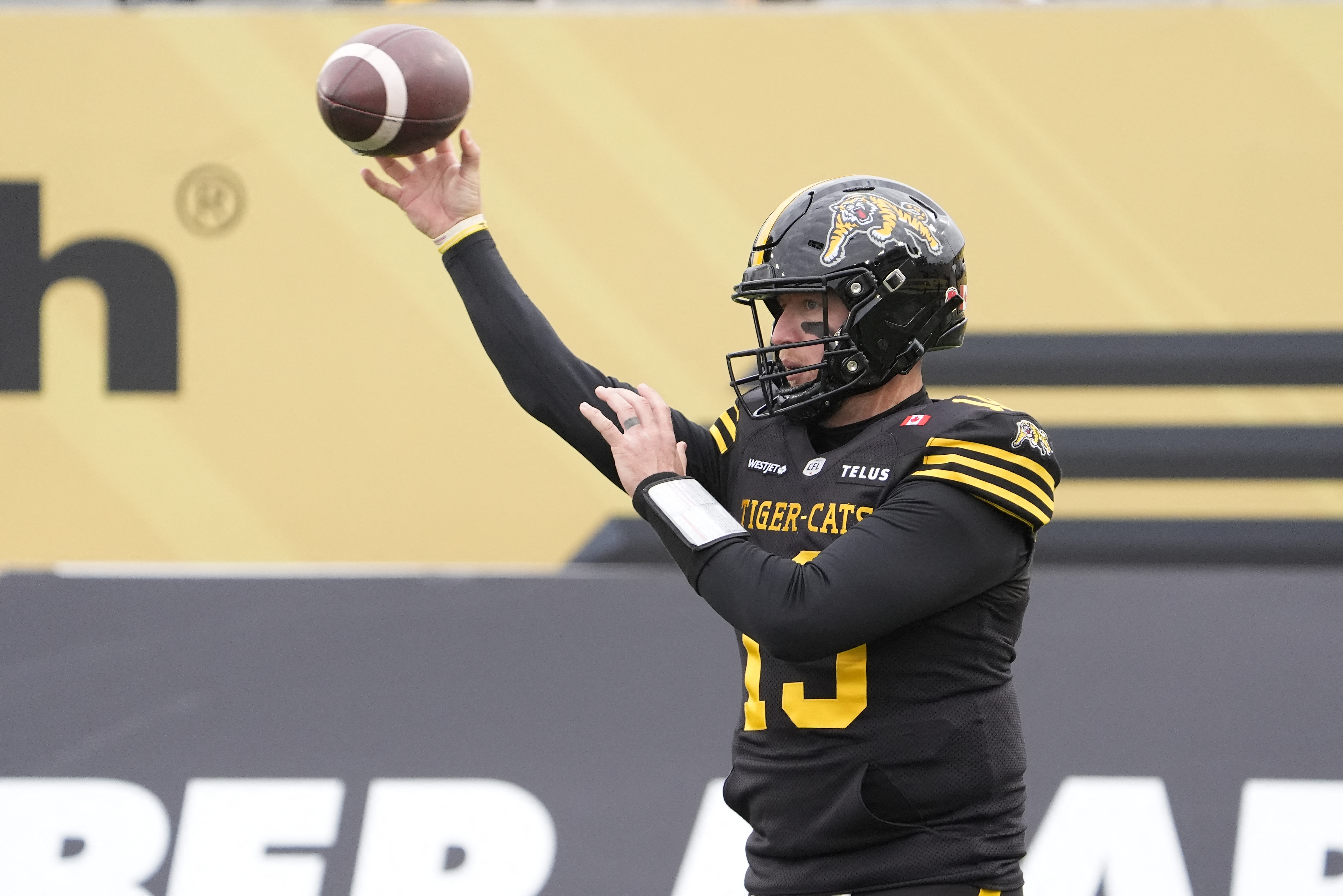 Hamilton Tiger-Cats quarterback Bo Levi Mitchell (19) passes the football as he is featured in our Lions vs. Tiger-Cats prediction & odds.