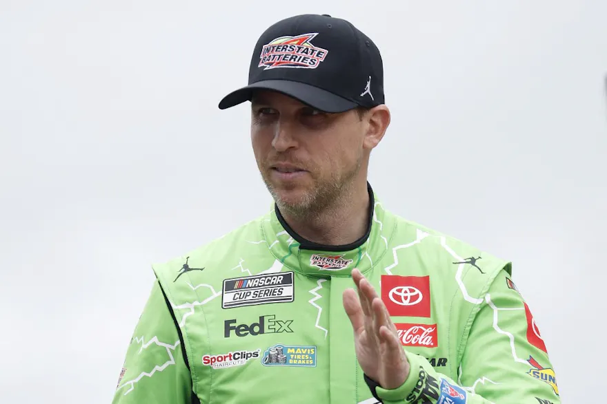 Denny Hamlin, driver of the #11 Interstate Batteries Toyota, waves to fans as he walks onstage during driver intros prior to the NASCAR Cup Series as we make our best Toyota Owners 400 picks from Richmond Raceway. 