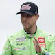 Denny Hamlin, driver of the #11 Interstate Batteries Toyota, waves to fans as he walks onstage during driver intros prior to the NASCAR Cup Series as we make our best Toyota Owners 400 picks from Richmond Raceway. 