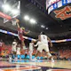 Anthony Black of the Arkansas Razorbacks attempts a layup in front of Jaylin Williams and Wendell Green Jr. of the Auburn Tigers at Neville Arena on Jan. 07, 2023 in Auburn, Alabama. 