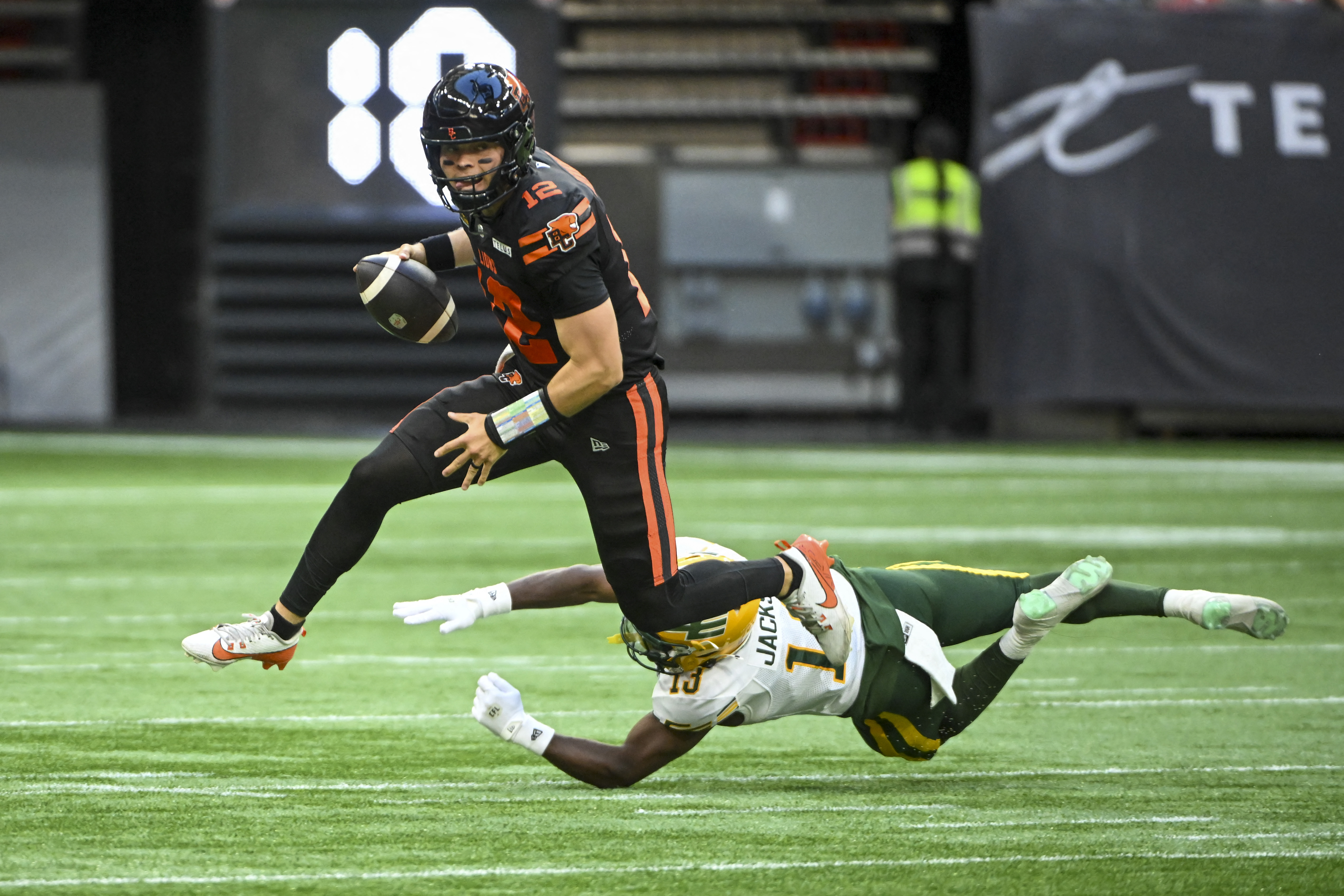 BC Lions quarterback Nathan Rourke (12) runs the ball as he is featured in our Lions vs. Elks prediction.