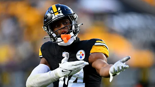 George Pickens #14 of the Pittsburgh Steelers reacts after a first down as we look at our Patriots vs. Steelers Week 14 Thursday Night Football prediction
