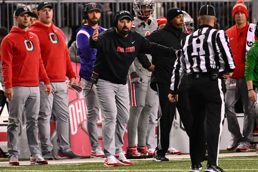 Head coach Ryan Day of the Ohio State Buckeyes speaks to a referee as we round up our college football predictions for Week 13