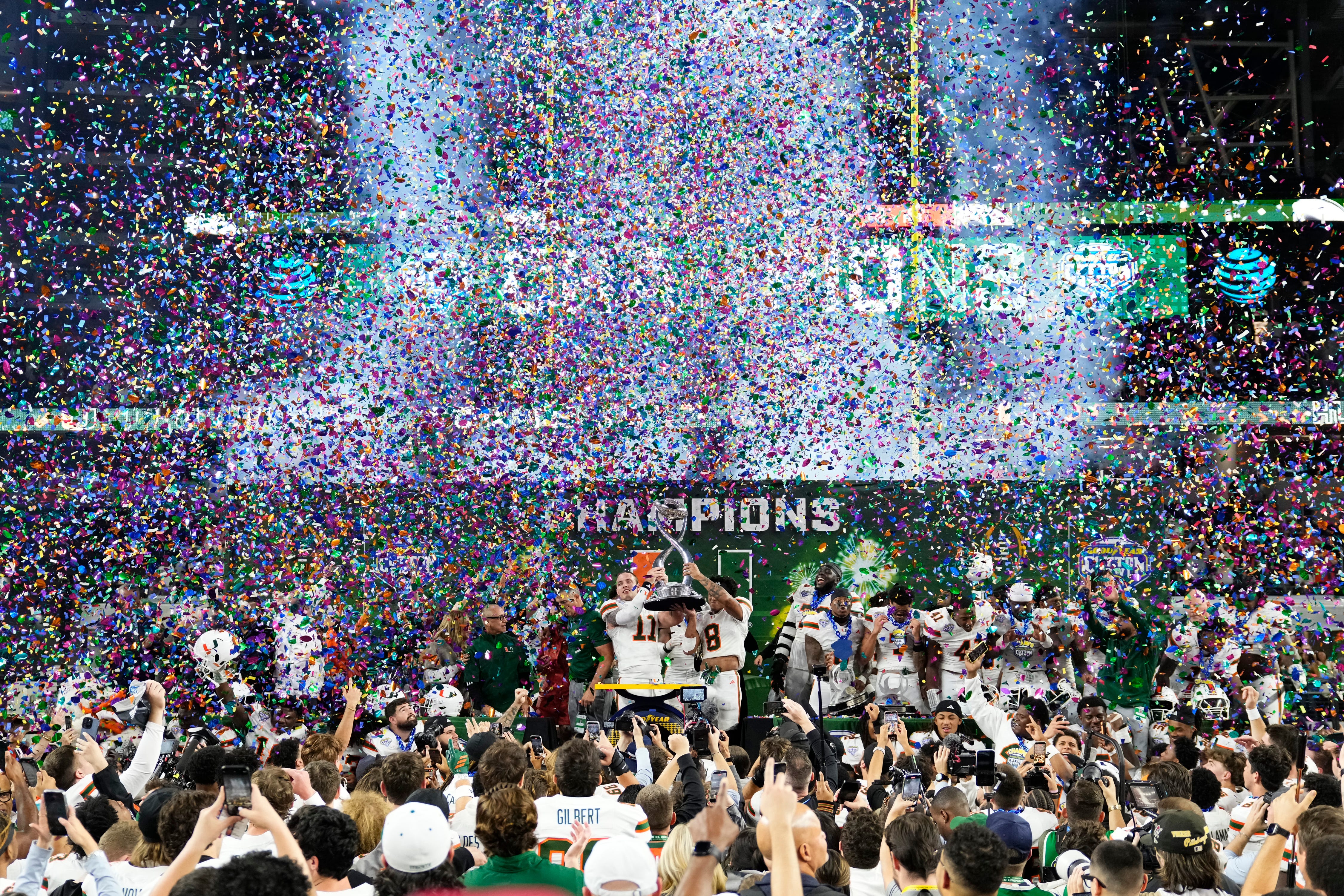 Miami Hurricanes quarterback Carson Beck (11) and defensive back Jakobe Thomas (8) celebrate as we break down the college football national championship odds and look-ahead lines for the CFP title game.