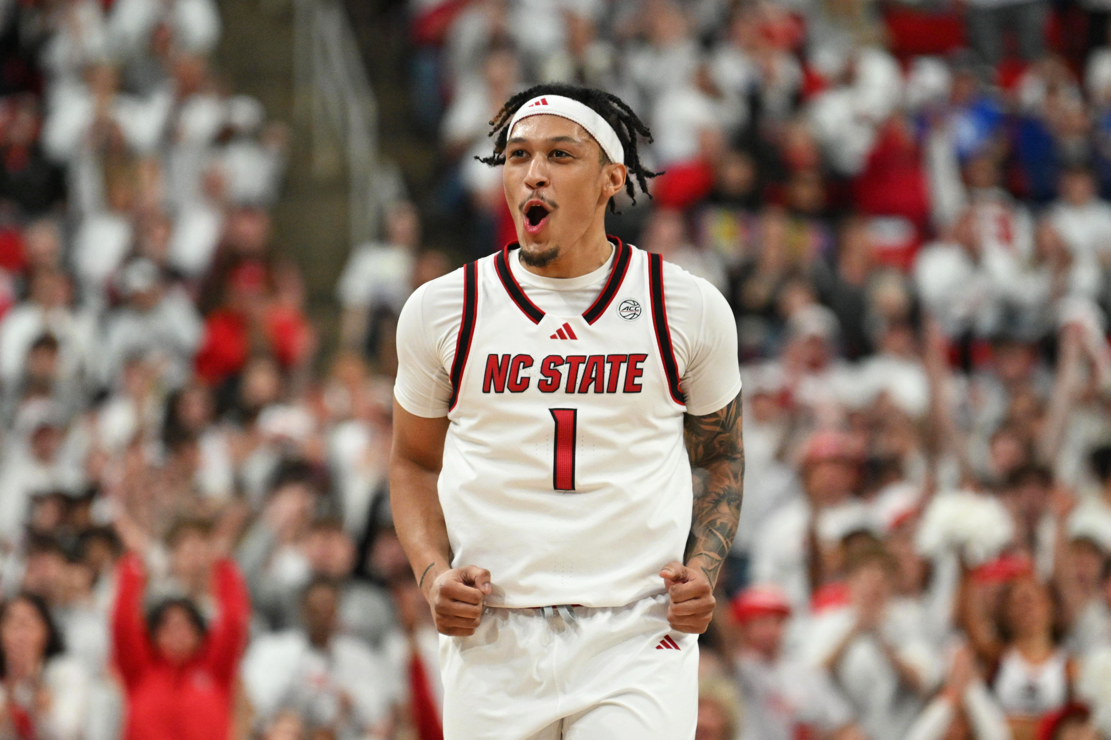 NC State Wolfpack forward Darrion Williams (1), seen here reacting after scoring, is featured in our First Four picks tonight.