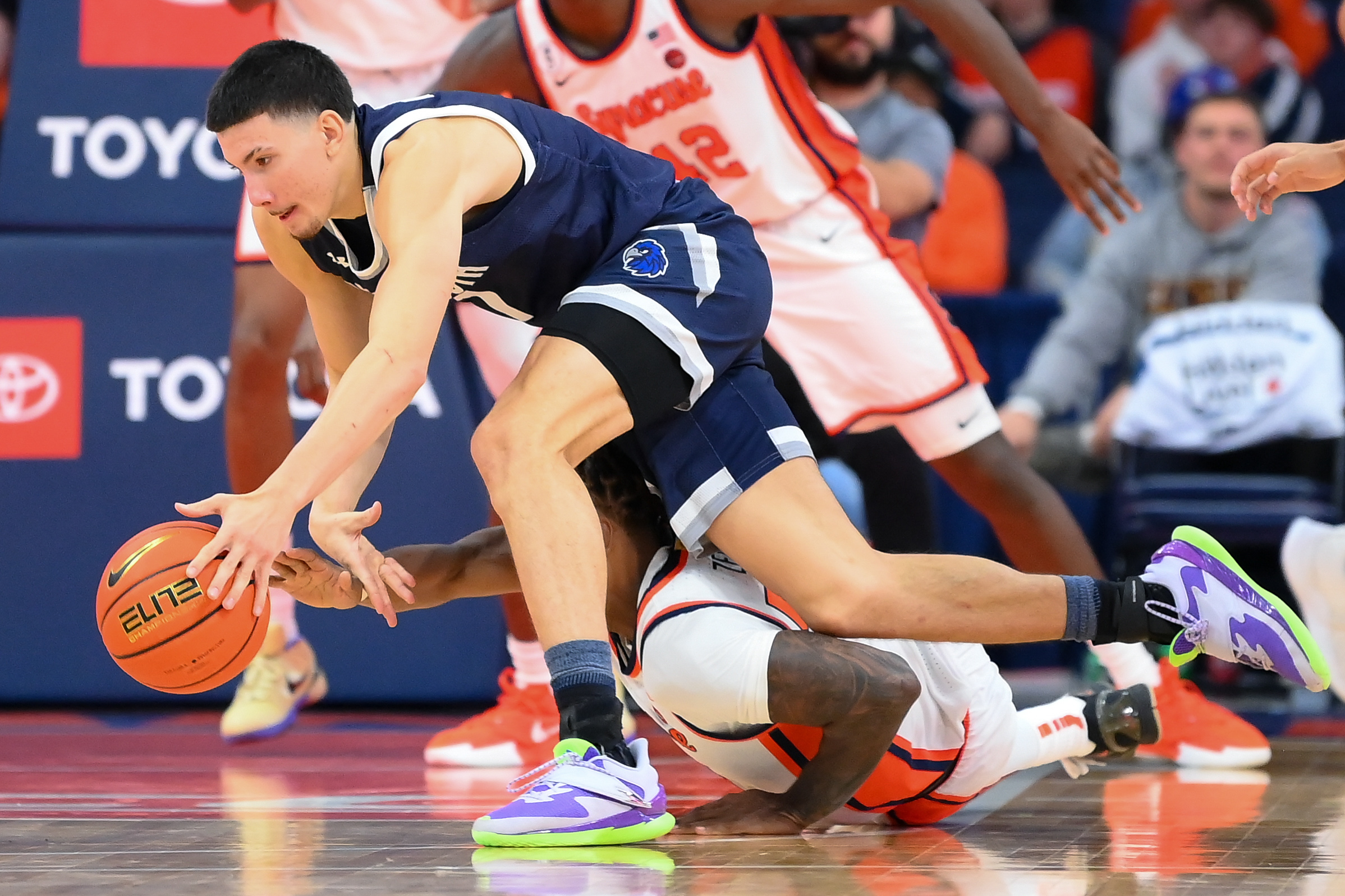 Monmouth Hawks forward Jason Rivera-Torres (1) battles as he is featured in our Monmouth vs. Hofstra prediction & odds.