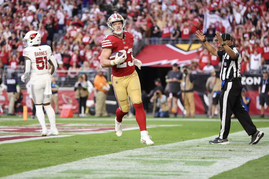 Christian McCaffrey #23 of the San Francisco 49ers scores a touchdown as we look at the best Monday Night Football odds for Week 16