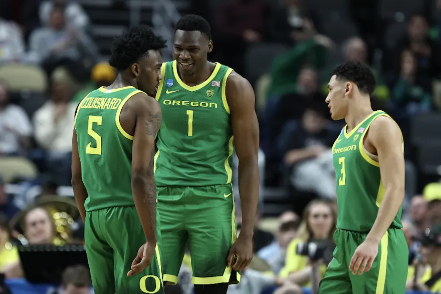 N'Faly Dante #1 of the Oregon Ducks reacts with Jermaine Couisnard #5 as we make our Oregon vs. Creighton expert pick and prediction for the second round of the NCAA Tournament on Saturday.