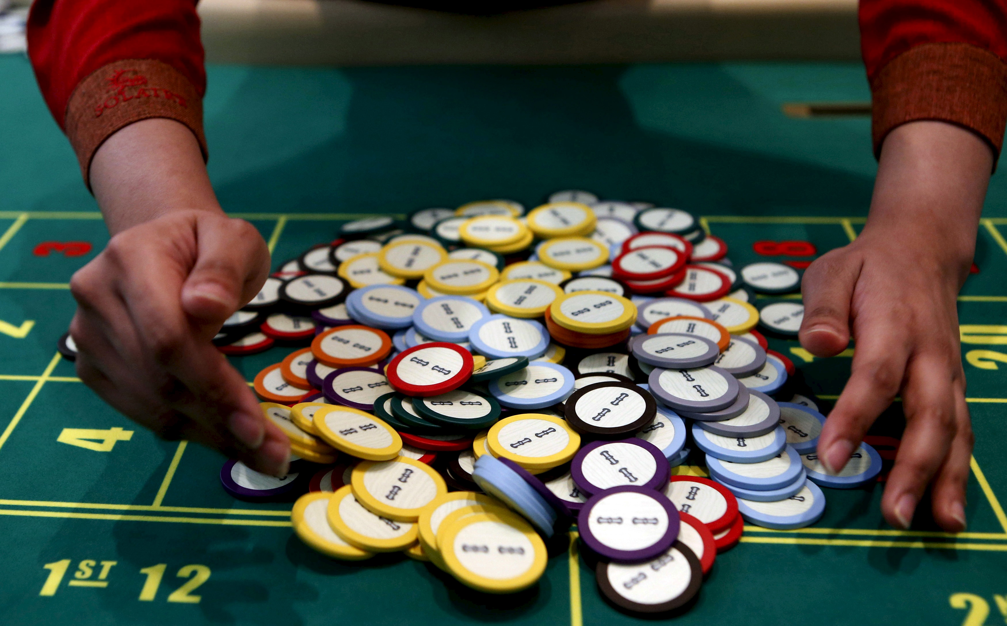 A casino dealer collects chips at a roulette table as we look at Oklahoma banning sweepstakes.