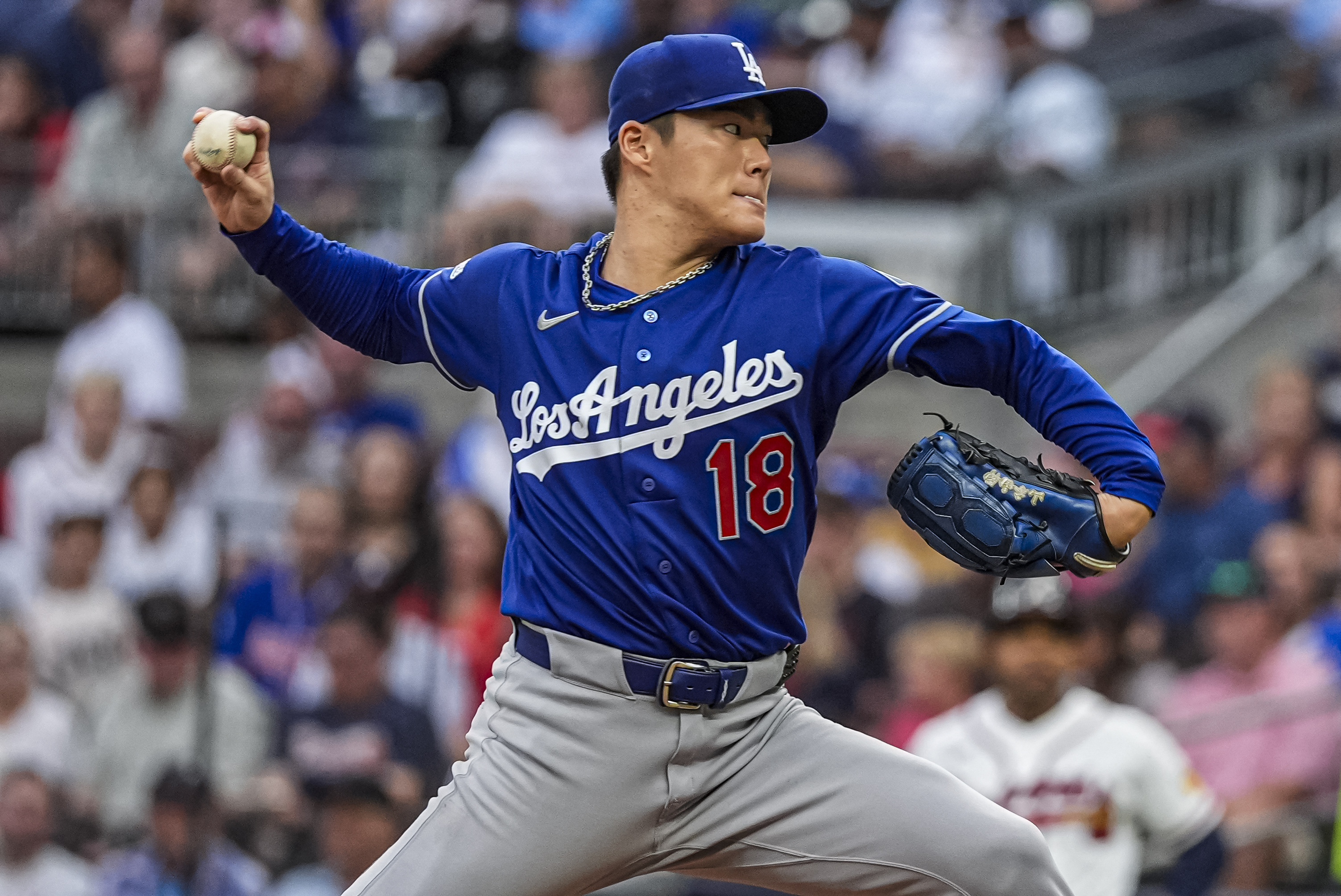 Los Angeles Dodgers pitcher Yoshinobu Yamamoto (18) pitches as he is featured in our Cardinals vs. Dodgers prediction.