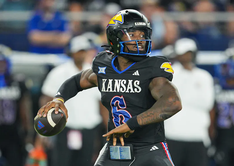 Kansas Jayhawks quarterback Jalon Daniels throws a pass against the UNLV Rebels.