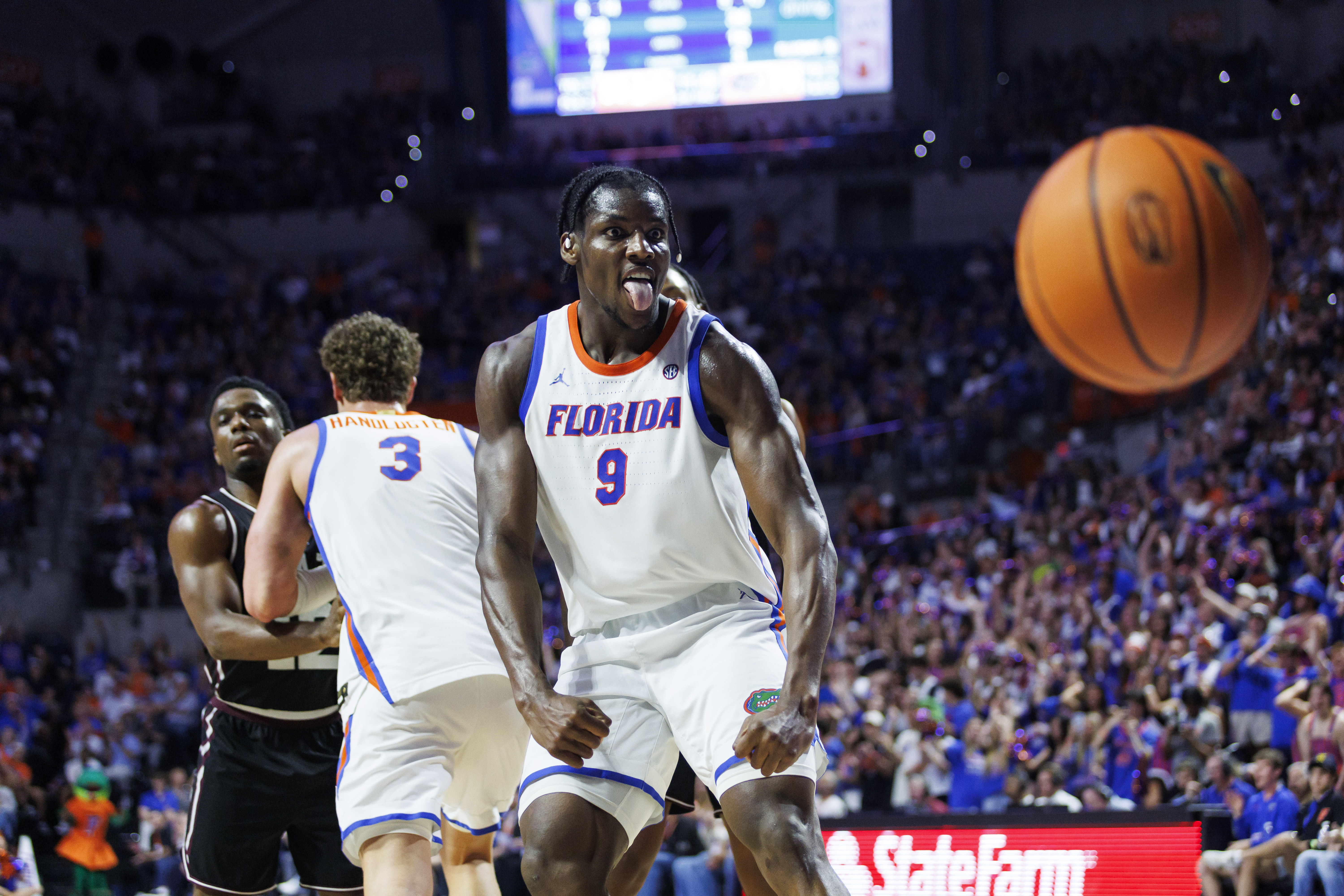 Florida Gators center Rueben Chinyelu (9) reacts after a dunk as we break down our Iowa vs. Florida prediction & picks.