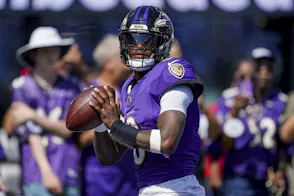 Baltimore Ravens quarterback Lamar Jackson - who's featured in our Lamar Jackson player prop bets - warms up.