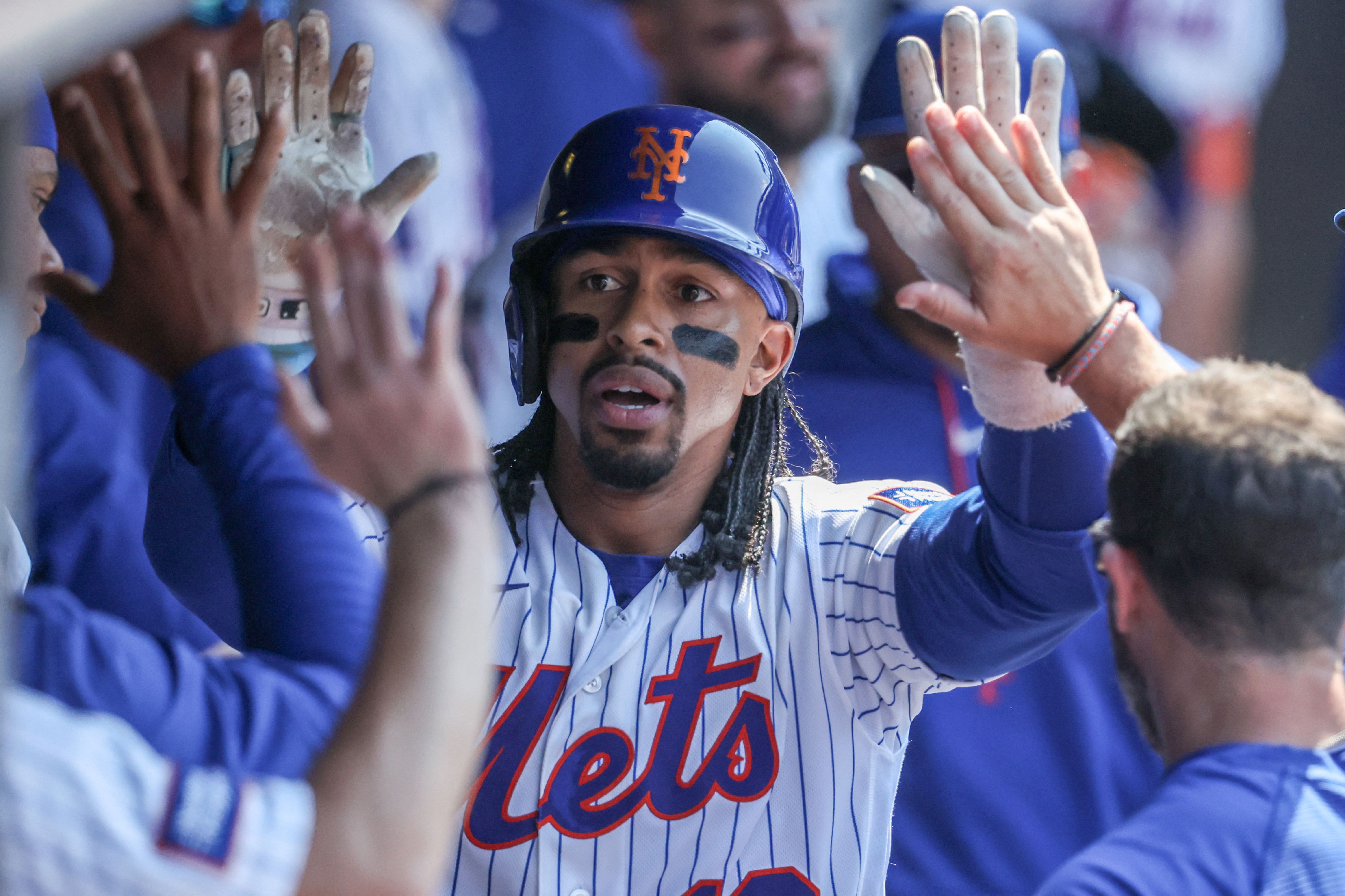 New York Mets shortstop Francisco Lindor is greeted in the dugout, and he's featured in my best home run predictions today.