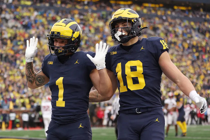 Roman Wilson of the Michigan Wolverines celebrates his first-half touchdown with Colston Loveland while we look at the latest Big Ten title odds.