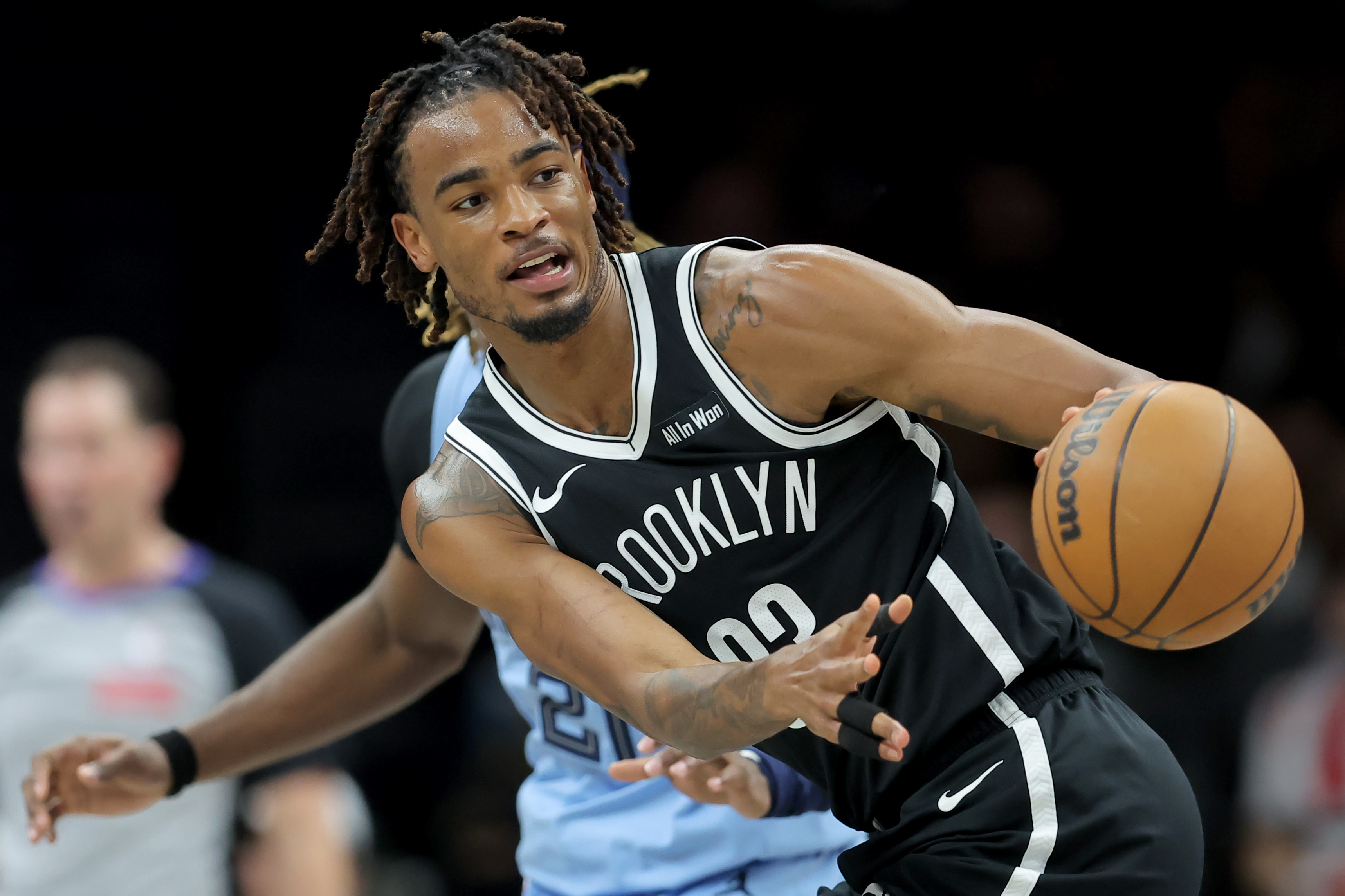 Brooklyn Nets center Nic Claxton passes the ball as we look at the partnership between Underdog and Aristotle Exchange DCM.