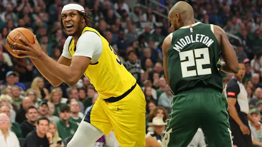 Myles Turner (33) of the Indiana Pacers works against Khris Middleton (22) of the Milwaukee Bucks, as we offer our best Bucks vs. Pacers player props for Game 6 on Thursday.