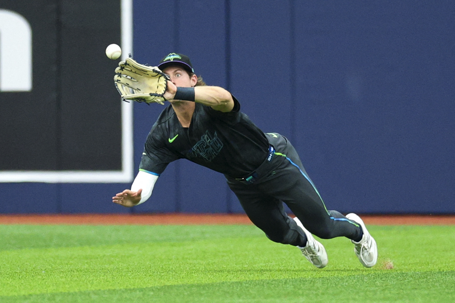 Tampa Bay Rays center fielder Jonny DeLuca makes a diving catch as we make our best Rays vs. Orioles prediction
