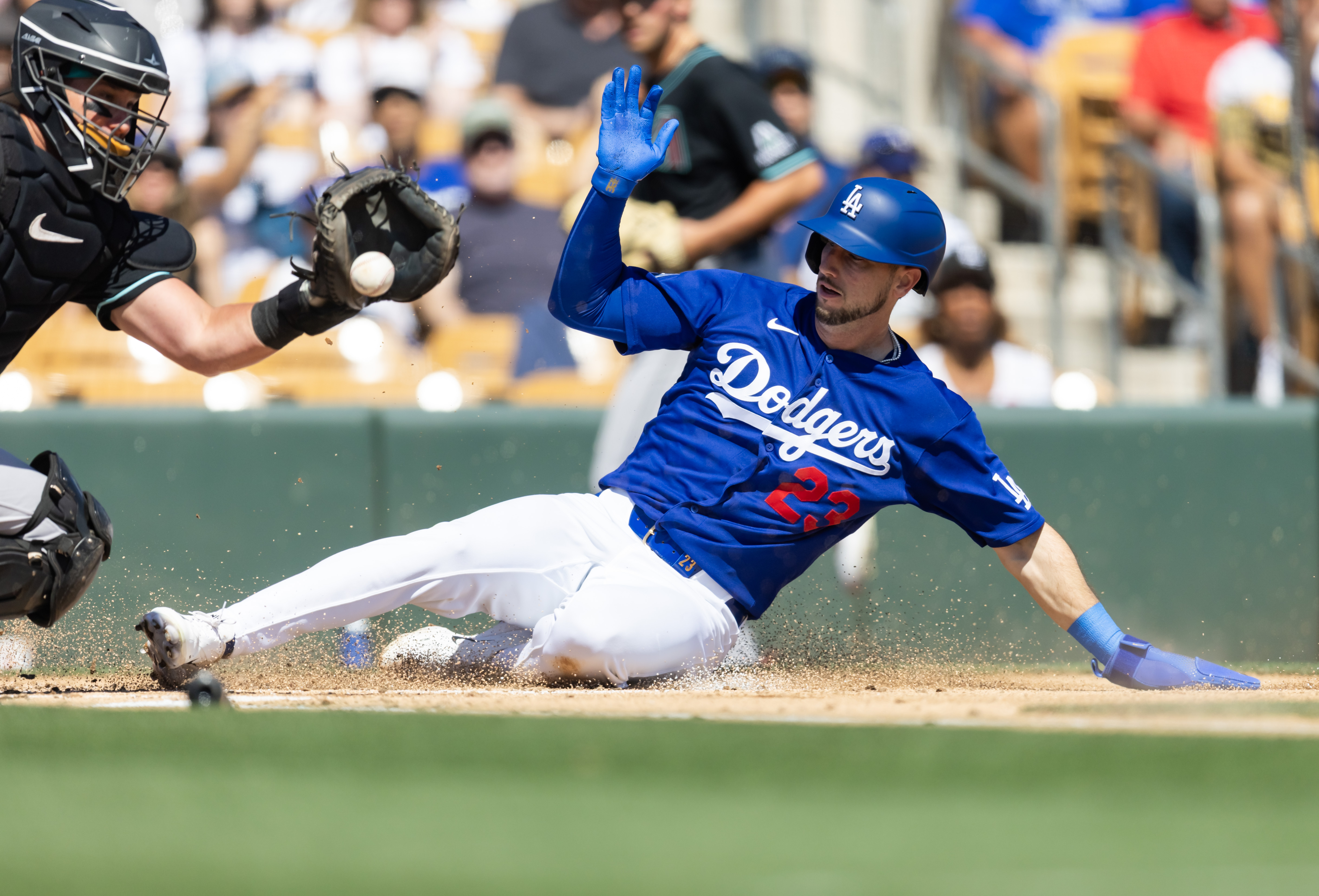 Los Angeles Dodgers base runner Kyle Tucker slides into home as we offer our MLB best bets for Opening Day.