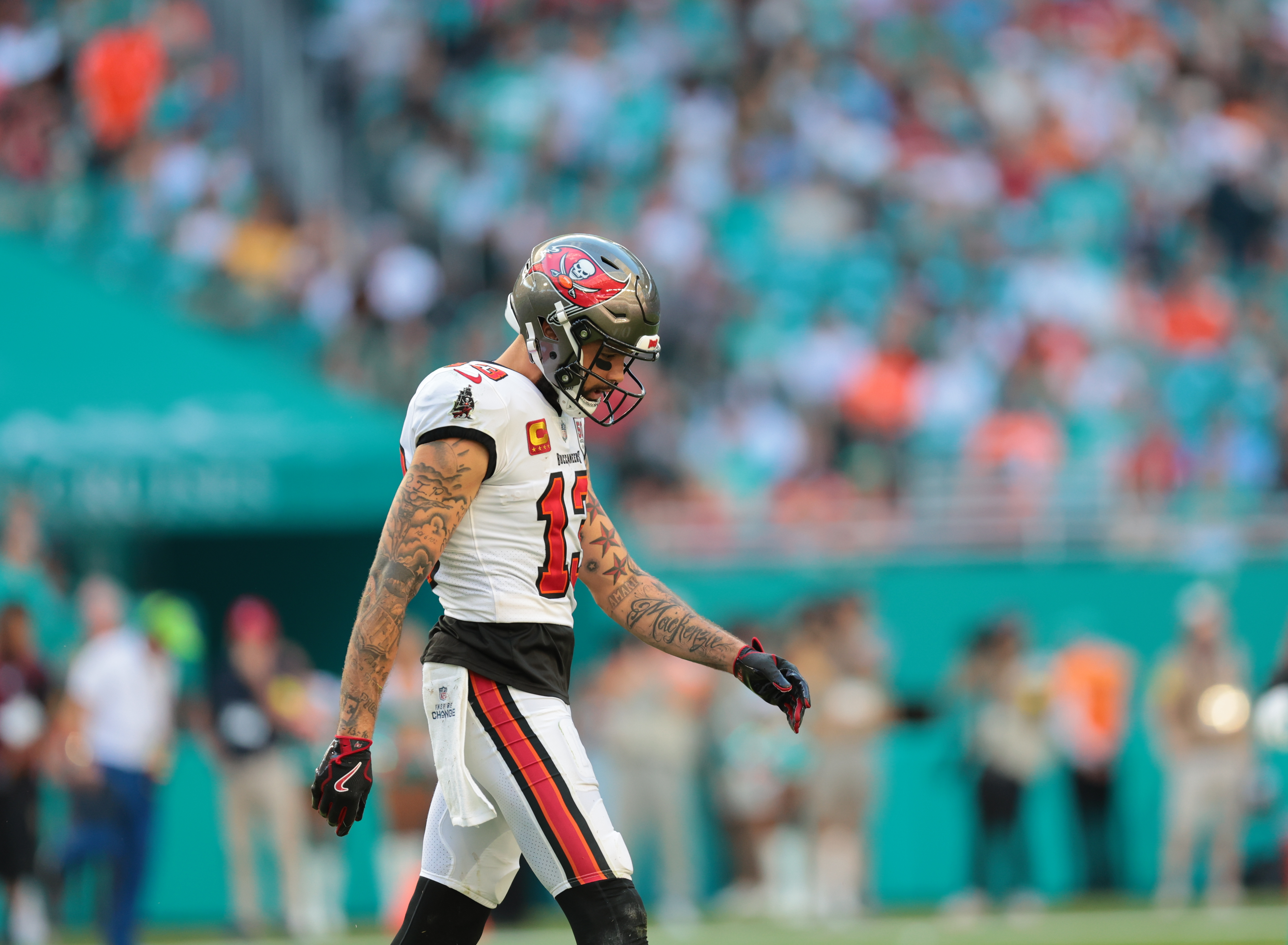 Tampa Bay Buccaneers wide receiver Mike Evans (13), who could retire after his team's Week 18 game against the Panthers, walks off the field.