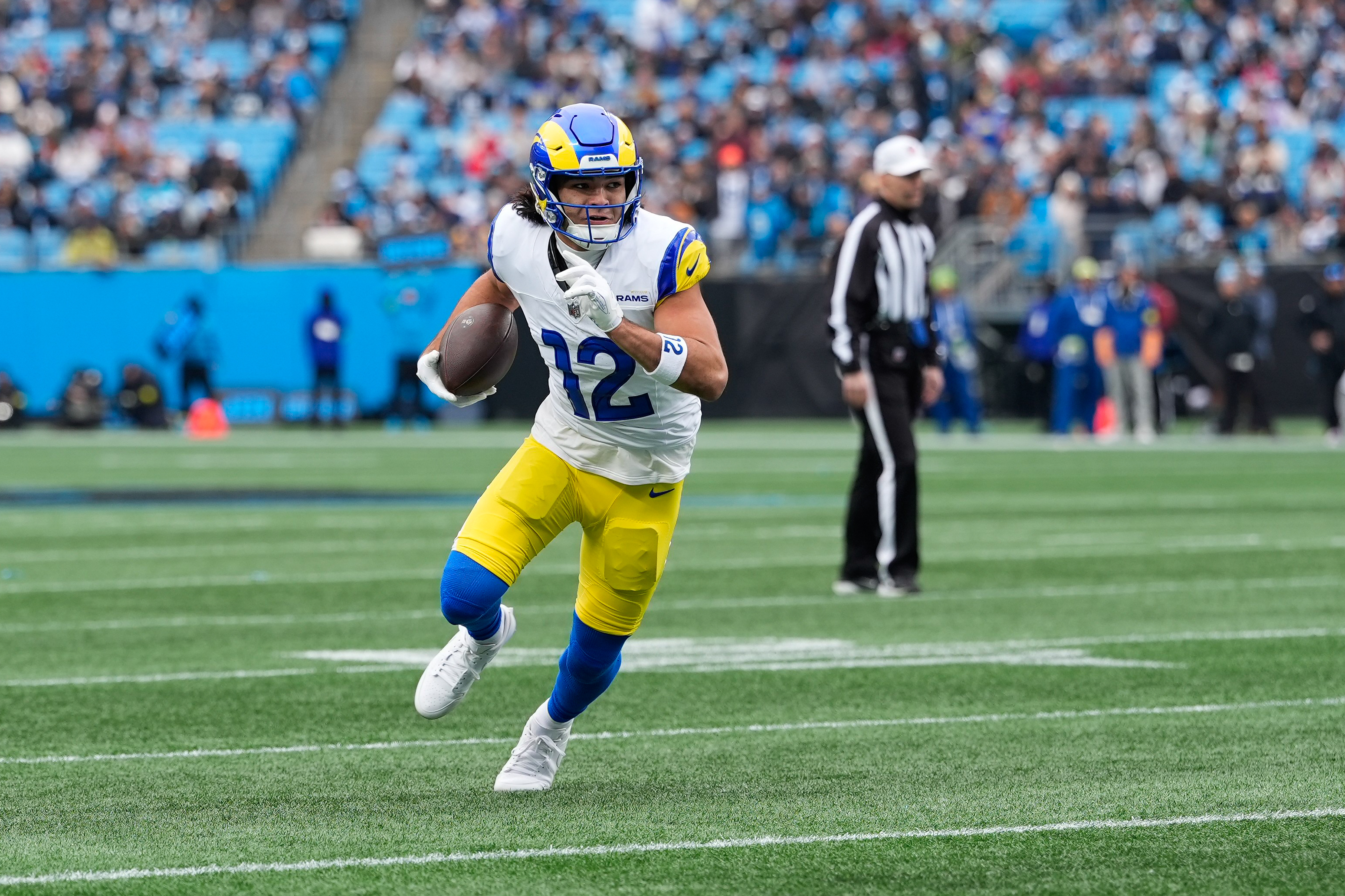 Los Angeles Rams wide receiver Puka Nacua (12) runs after making a catch as we offer our Rams vs. Panthers predictions.