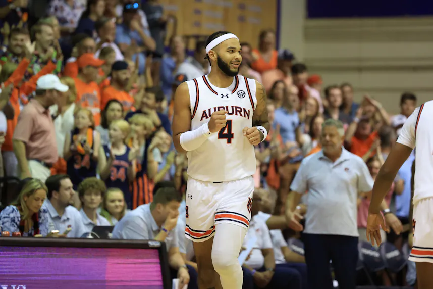 Auburn Tigers forward Johni Broome runs down the court as we make our college basketball best bets for Dec. 4