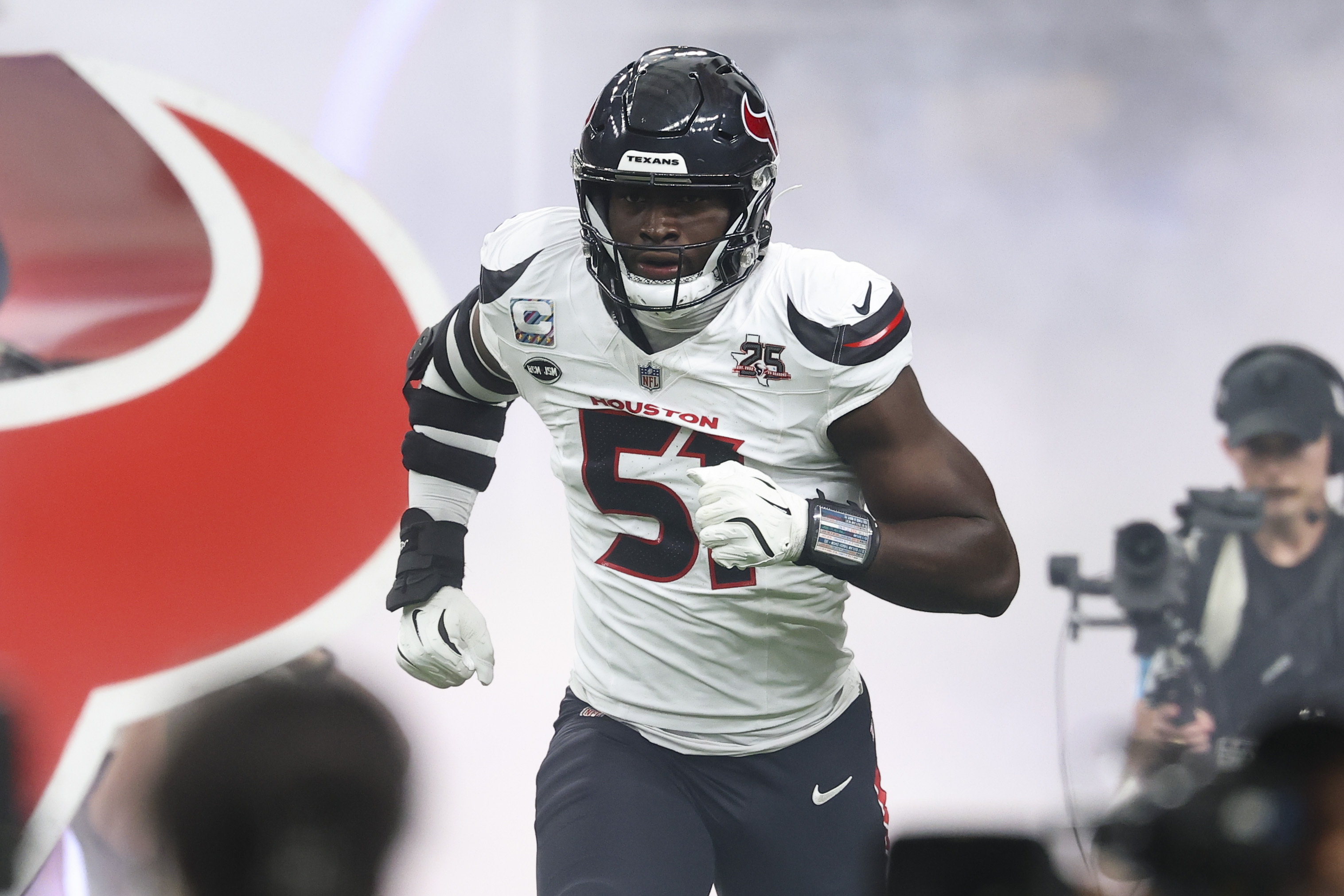 Houston Texans defensive end Will Anderson Jr. (51) runs onto the field before the game against the Dallas Cowboys at Reliant Stadium as we examine the 2026-2027 NFL DPOY odds. 