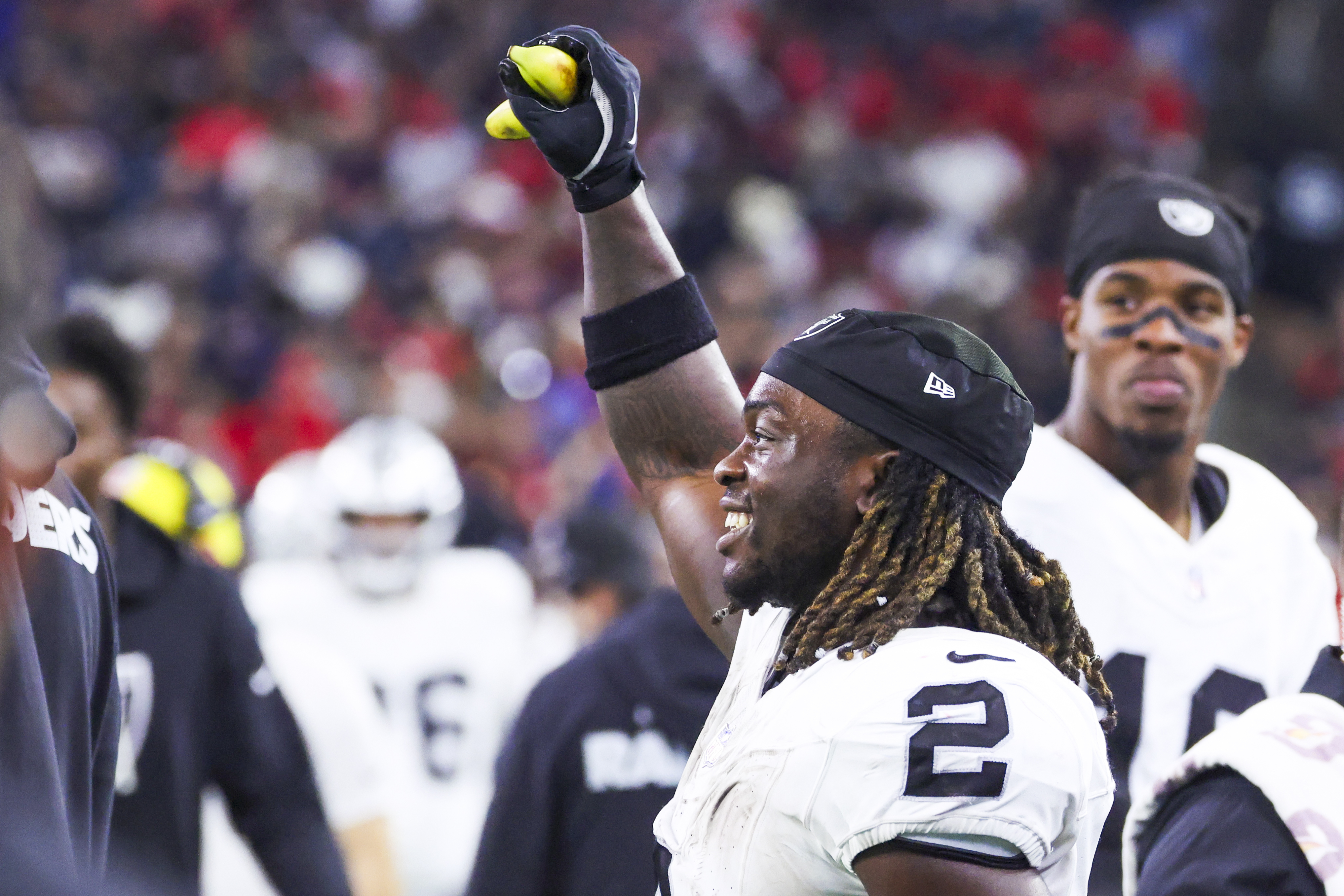 Las Vegas Raiders running back Ashton Jeanty holds a banana on the sideline as we offer our best Week 17 NFL upset picks.