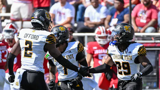Kennesaw State's Caleb Offord (2) and Milon Jones (29) celebrate against Indiana. We're backing the Owls in our UTEP vs. Kennesaw State prediction.
