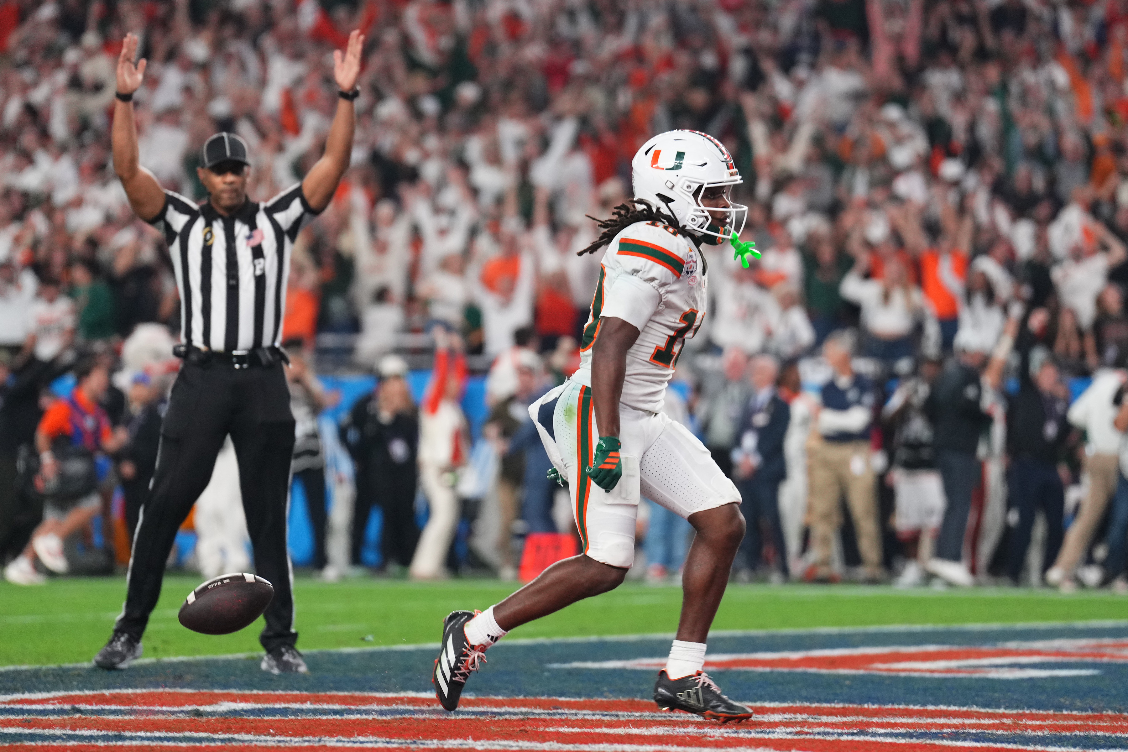 Miami's Malachi Toney scores in the CFP semifinal against Ole Miss, as we break down the CFP National Championship odds and storylines for Miami vs. Indiana.