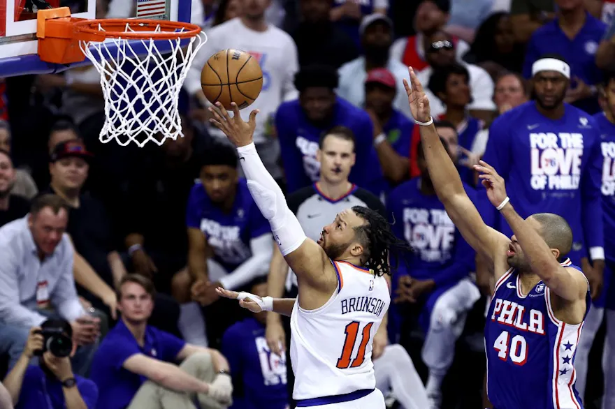 Jalen Brunson of the New York Knicks drives past Nicolas Batum of the Philadelphia 76ers during the Game 6 of the NBA playoffs. We're backing Brunson in our NBA Player Props & Expert Picks. 