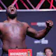 Derrick Lewis poses on the scale during the UFC 277 ceremonial weigh-in at American Airlines Center on July 29, 2022 in Dallas, Texas.