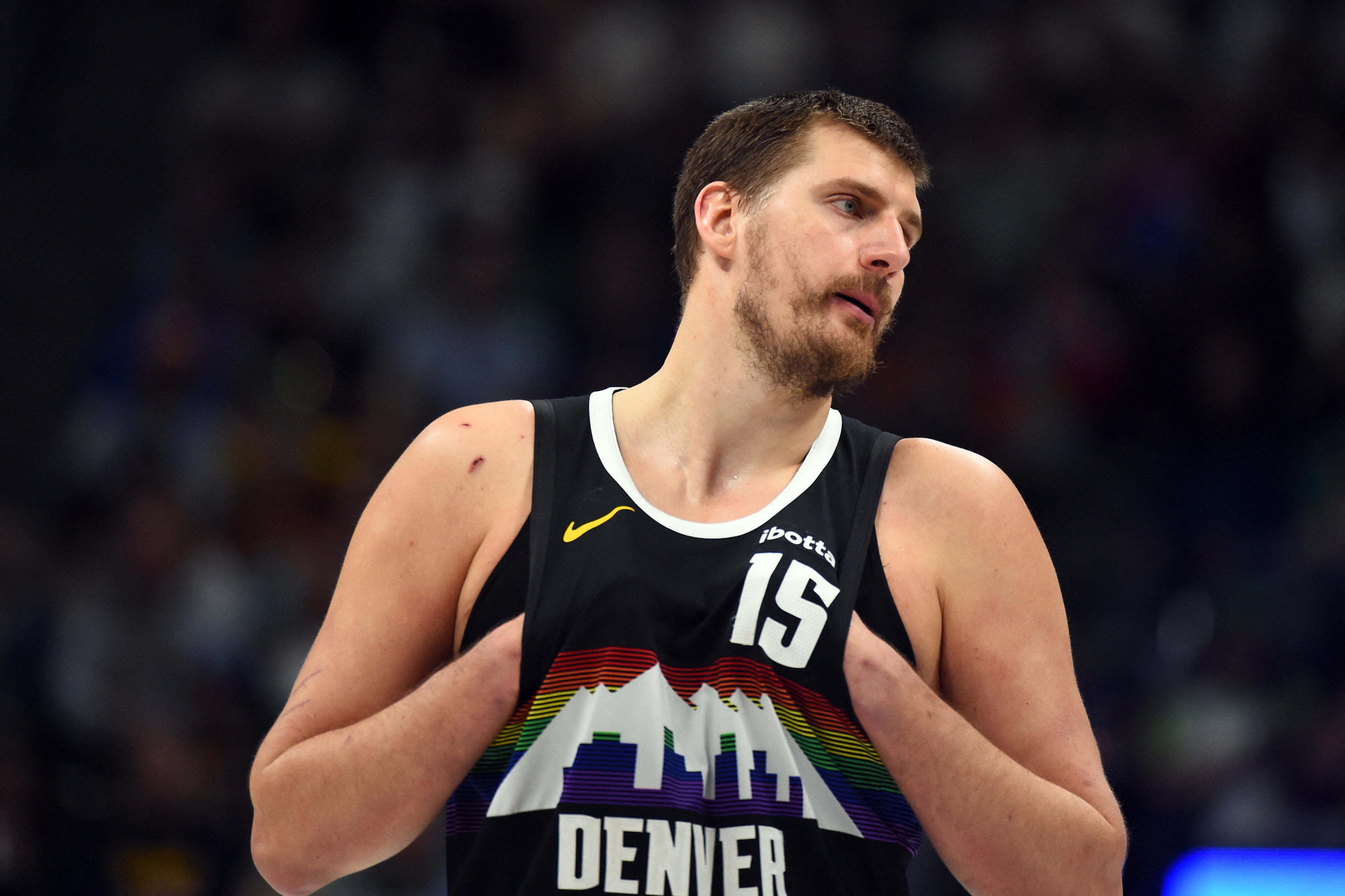 Denver Nuggets center Nikola Jokic (15), seen here looking on during a game, is featured in our NBA player props today.
