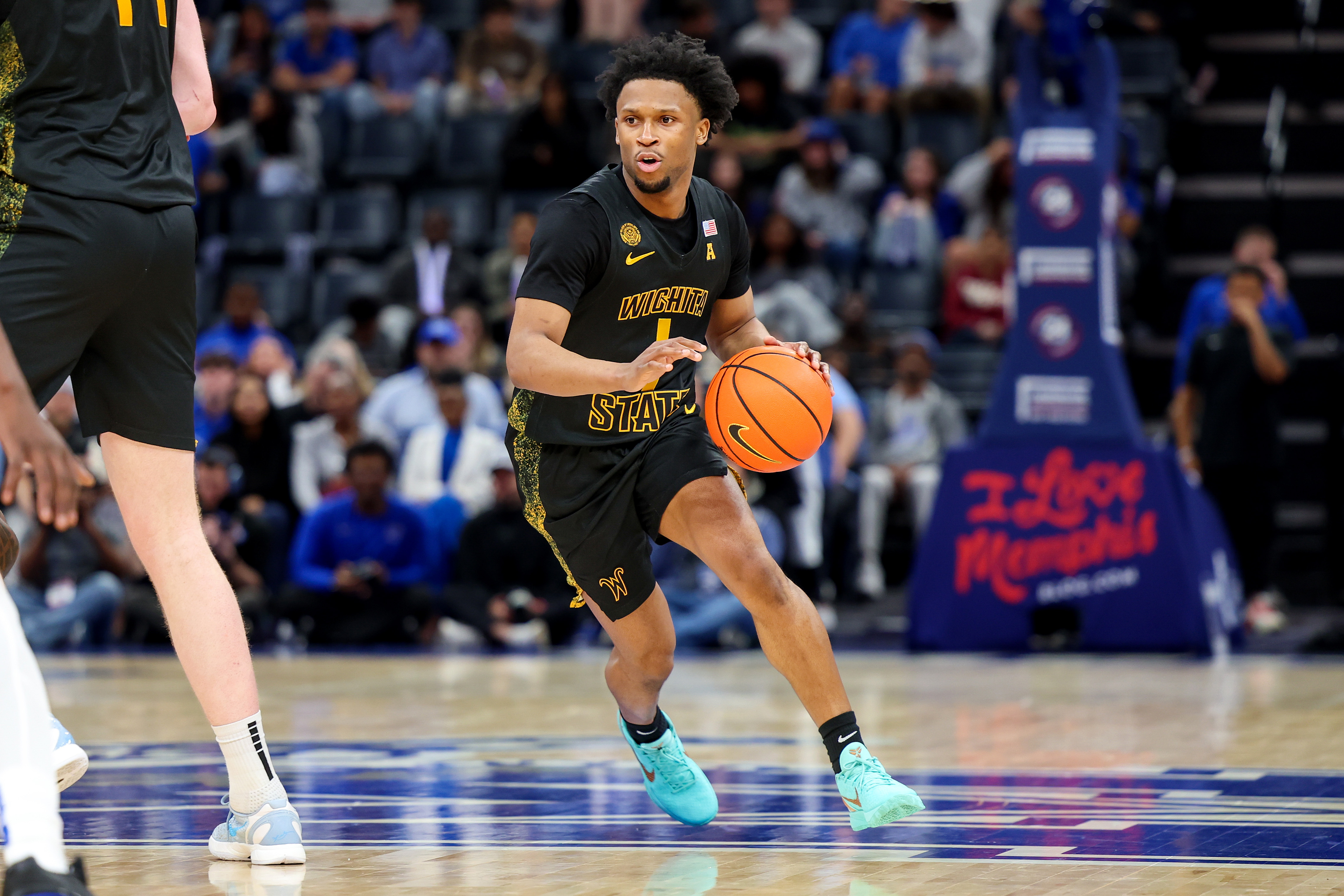 Wichita State Shockers guard Kenyon Giles handles the ball as we offer our Wichita State vs. South Florida prediction.