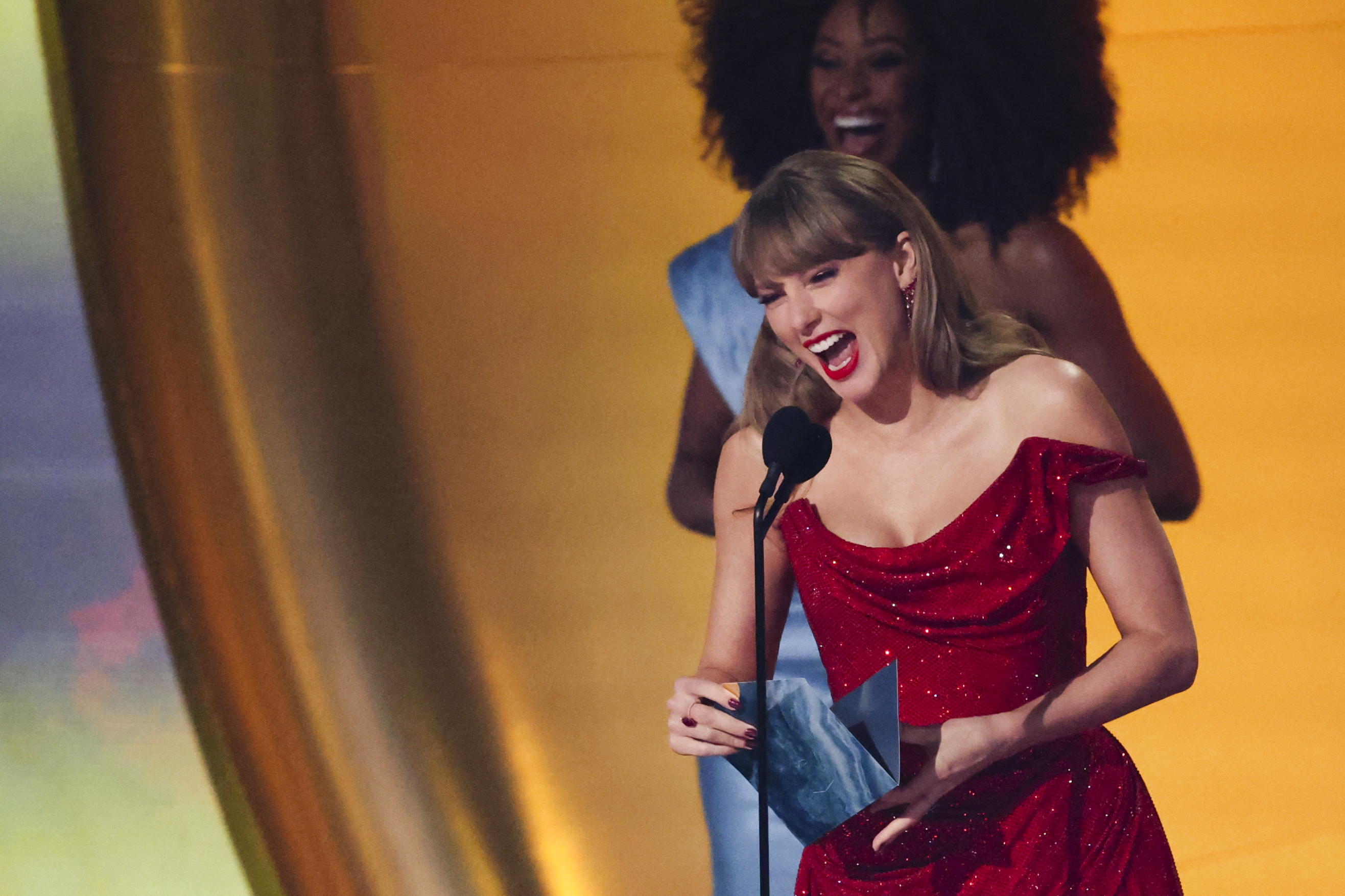 Taylor Swift reacts on stage as we break down our predicting the next 10 Super Bowl halftime show performers.