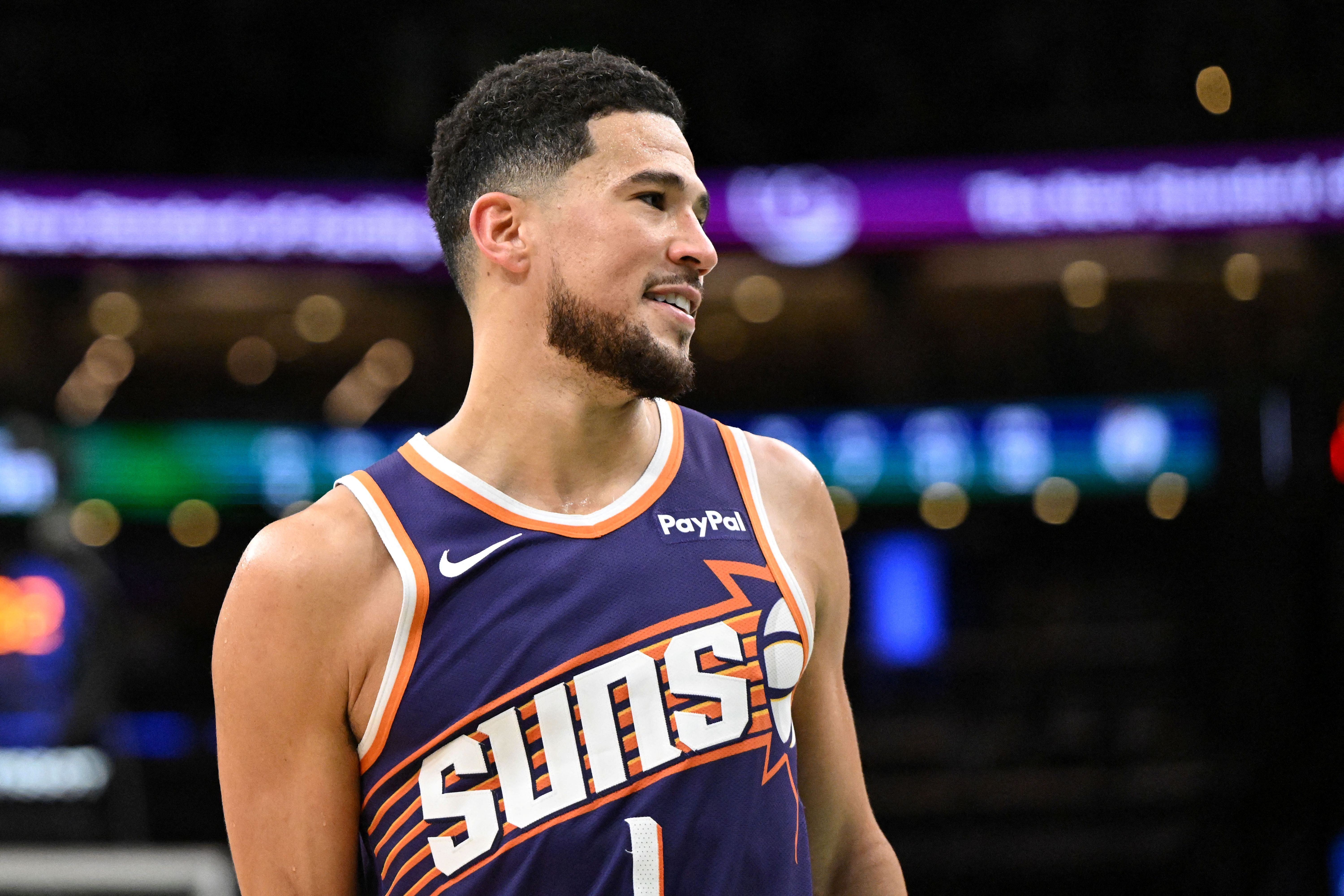 Phoenix Suns guard Devin Booker (1) reacts as we dive into our NBA player props tonight.