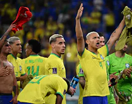 Brazil's Richarlison celebrates with supporters after his side defeated Switzerland.