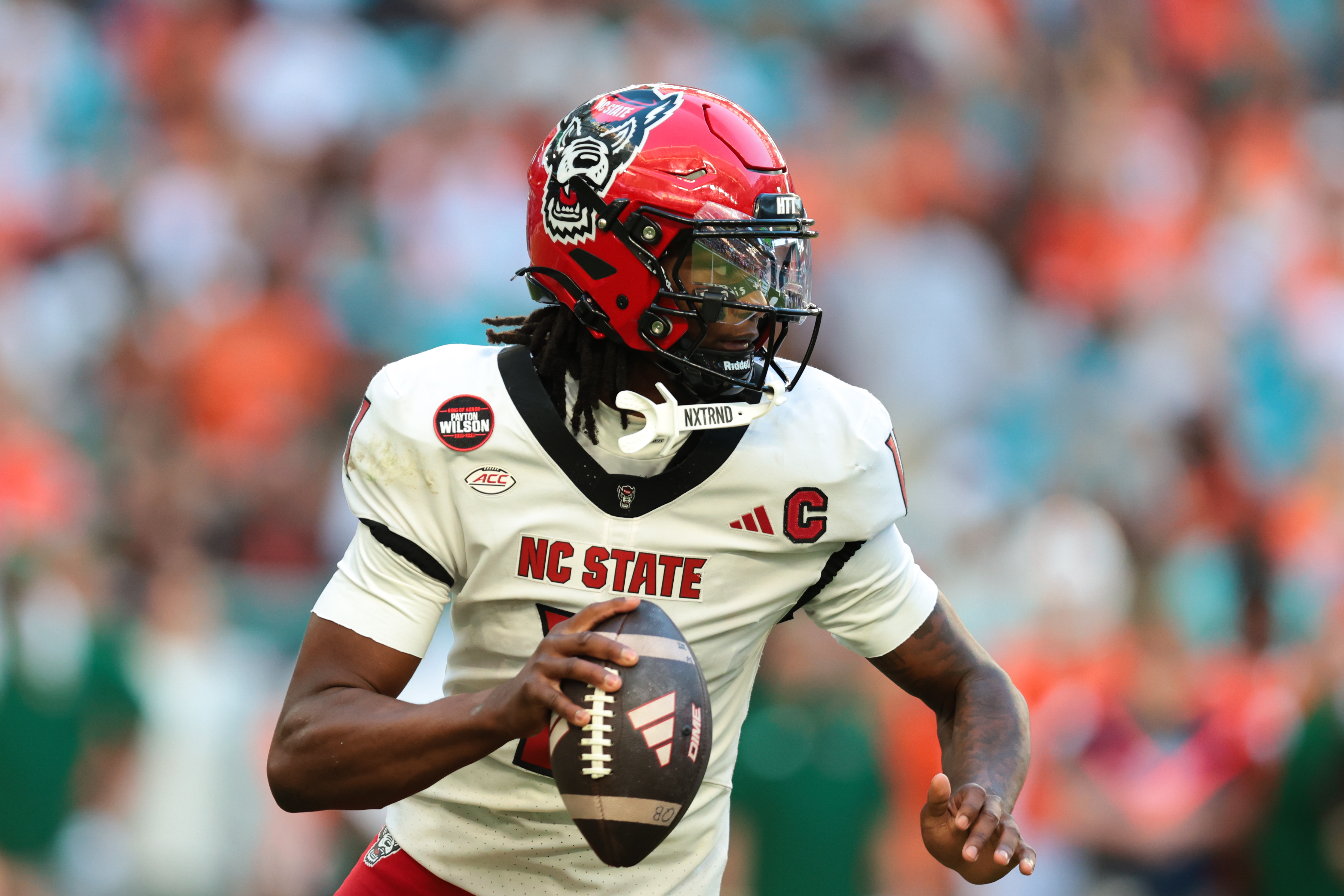 NC State quarterback CJ Bailey (11) looks to throw as we offer our Memphis vs. NC State predictions today.
