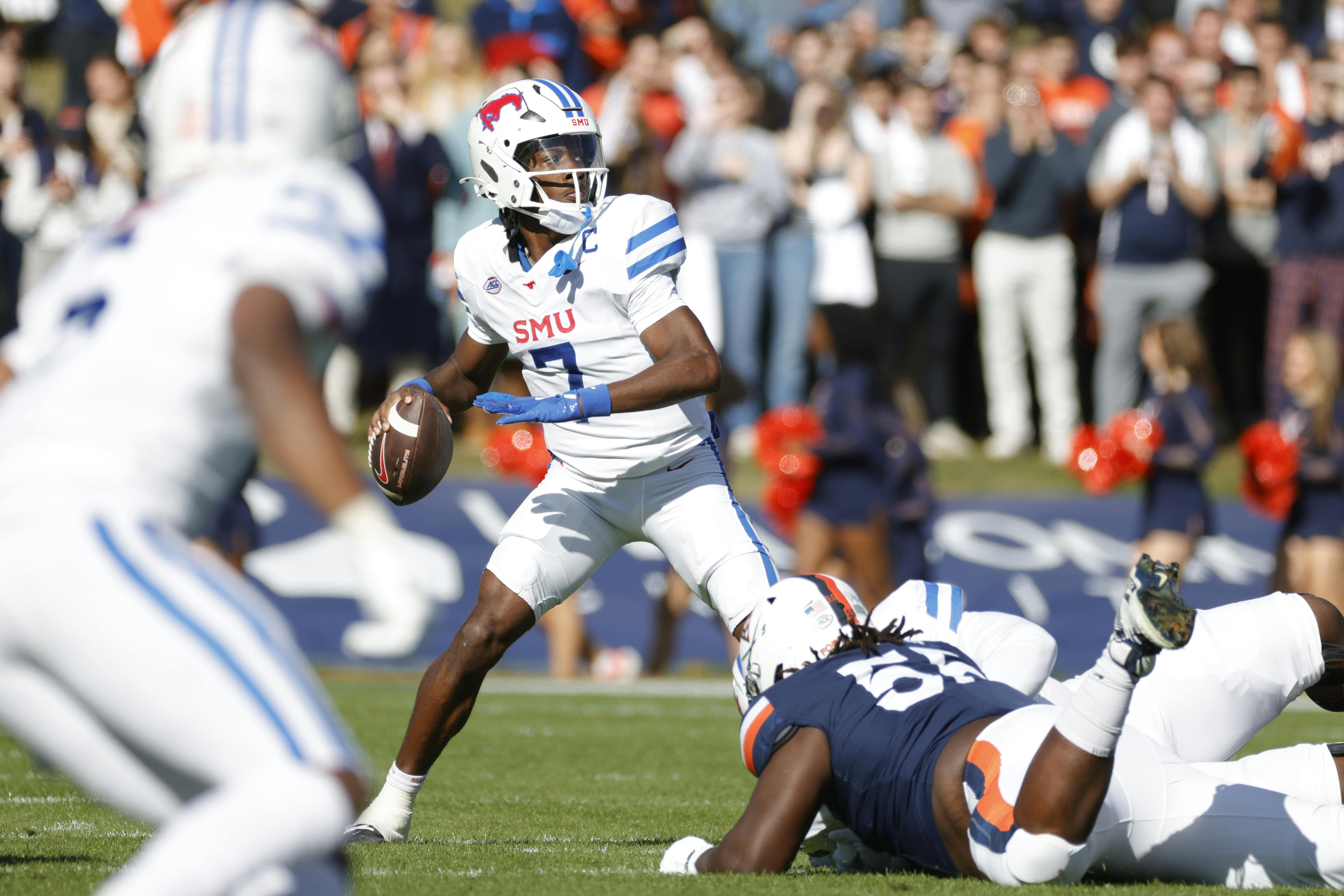 SMU quarterback Kevin Jennings prepares to throw the ball against Virginia. SMU trails only Miami by the ACC Championship odds.