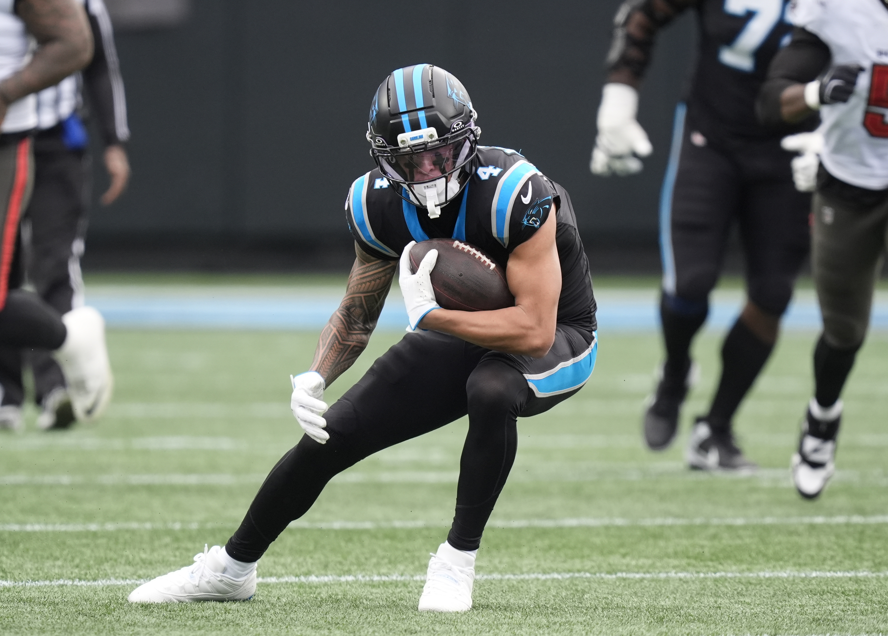 Carolina Panthers wide receiver Tetairoa McMillan (4) runs as we break down our NFL Offensive Rookie of the Year Odds 2026.