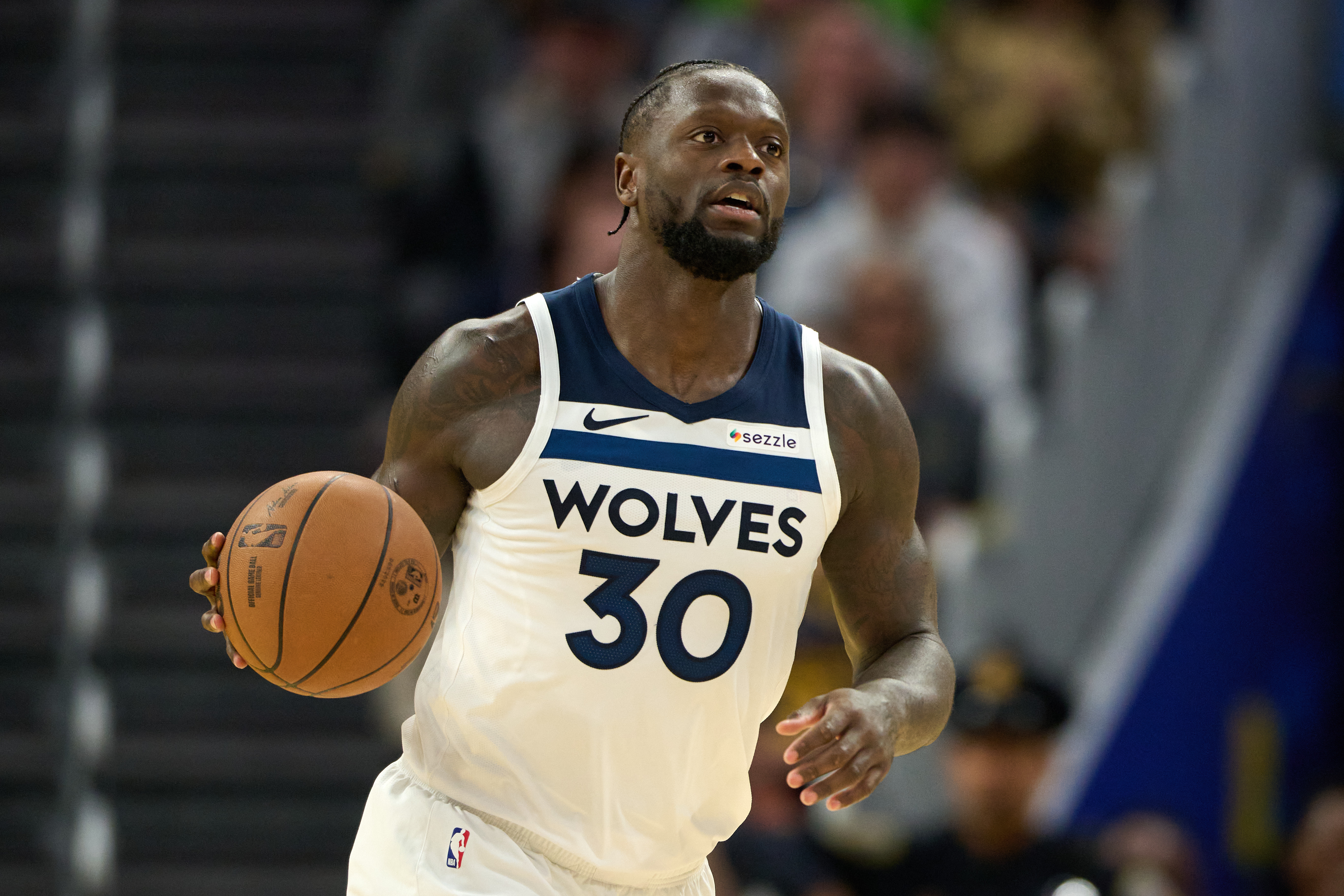 Minnesota Timberwolves forward Julius Randle (30) brings the ball up the court as we break down our Grizzlies vs. Timberwolves prediction.
