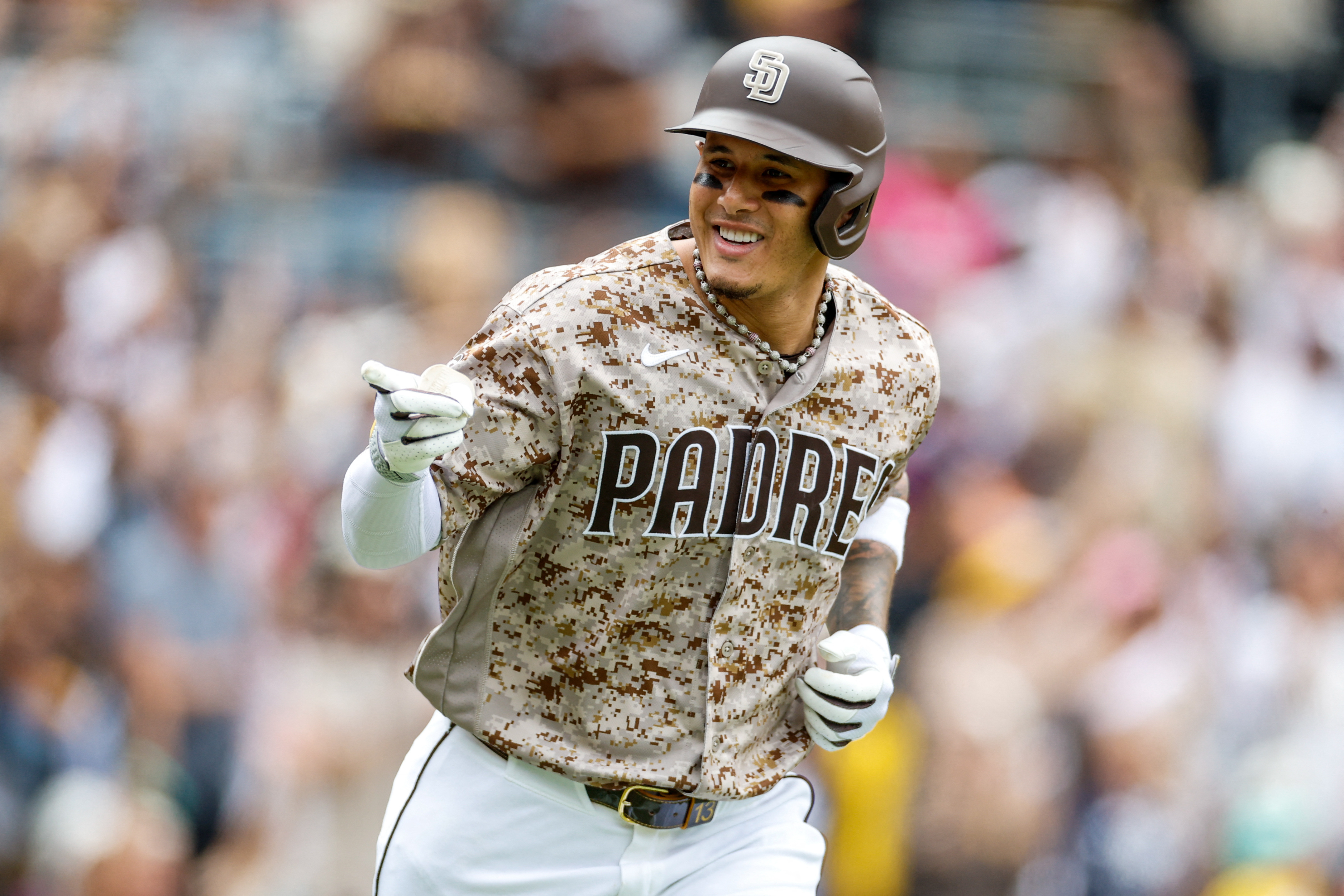 San Diego Padres third baseman Manny Machado (13), seen here celebrating during a game, is featured in our Cardinals vs. Padres prediction.