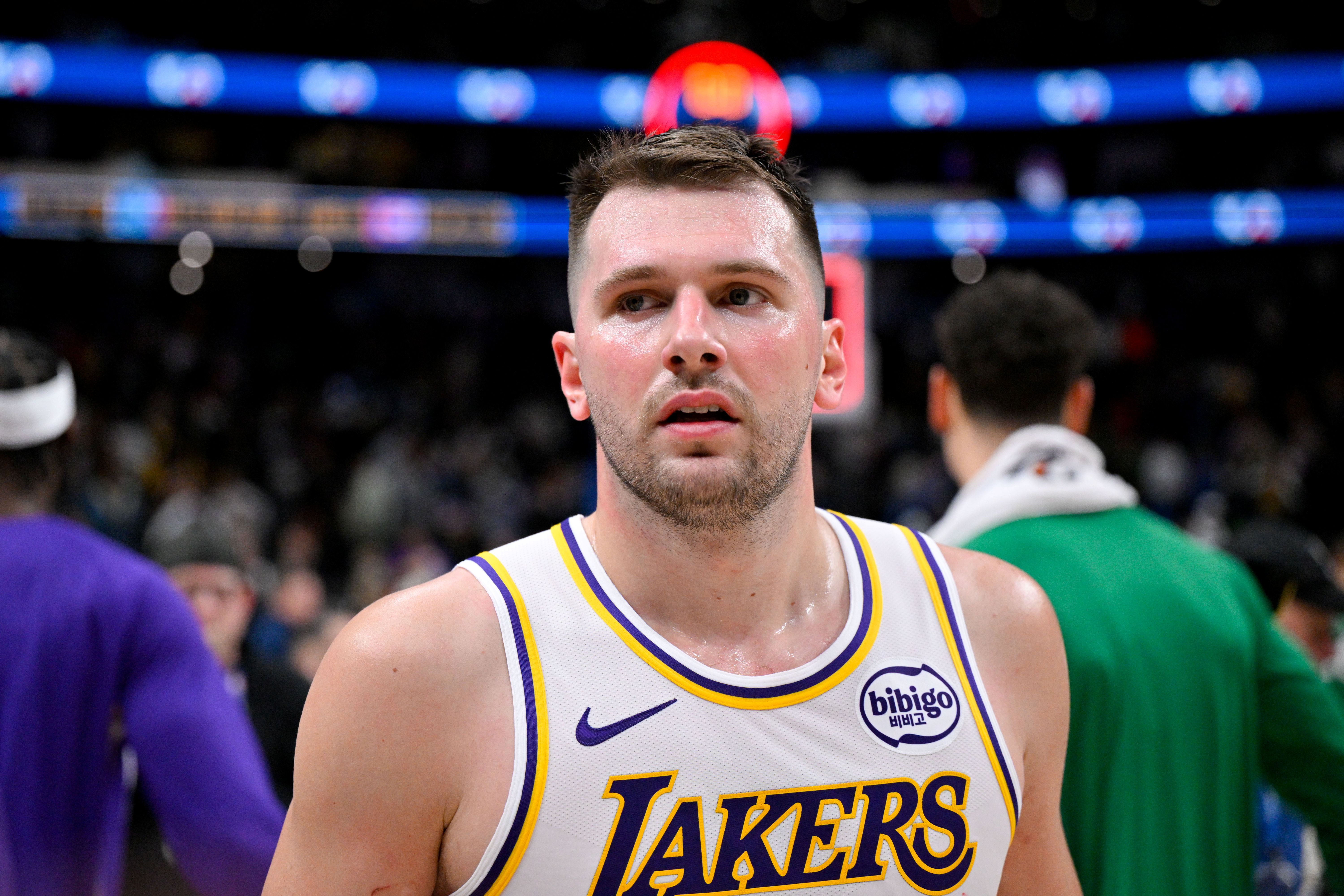 Los Angeles Lakers guard Luka Doncic (77), seen here walking off the court, is featured in our Timberwolves vs. Lakers player props tonight.