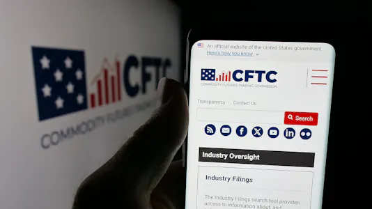 In this photo illustration, a cellphone with the webpage of Commodity Futures Trading Commission.