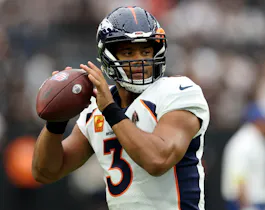 Russell Wilson of the Denver Broncos warms up before the game against the Las Vegas Raiders at Allegiant Stadium.