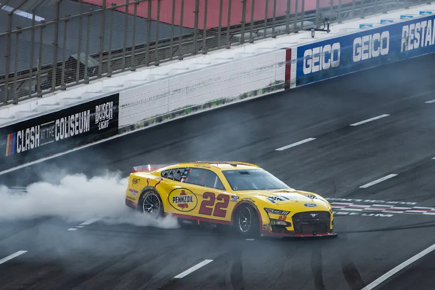 Joey Logano, driver of the No. 22 Shell Pennzoil Ford, celebrates with a burnout after winning the NASCAR Cup Series Busch Light Clash at the L.A. Memorial Coliseum on Feb. 6, 2022 in Los Angeles, California. 