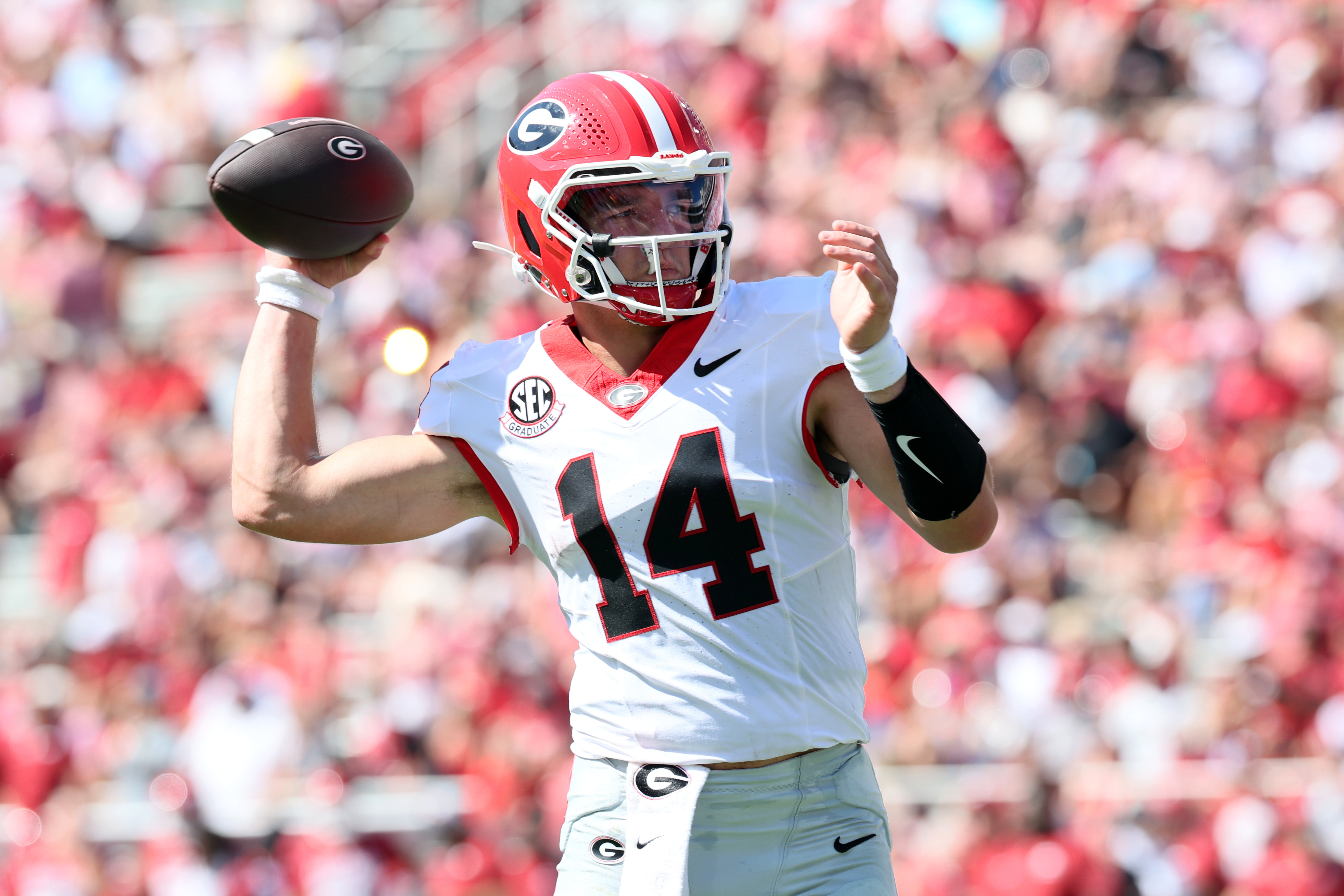 Georgia quarterback Gunner Stockton (14) passes the ball as we break down our Georgia vs. Alabama same-game parlay.