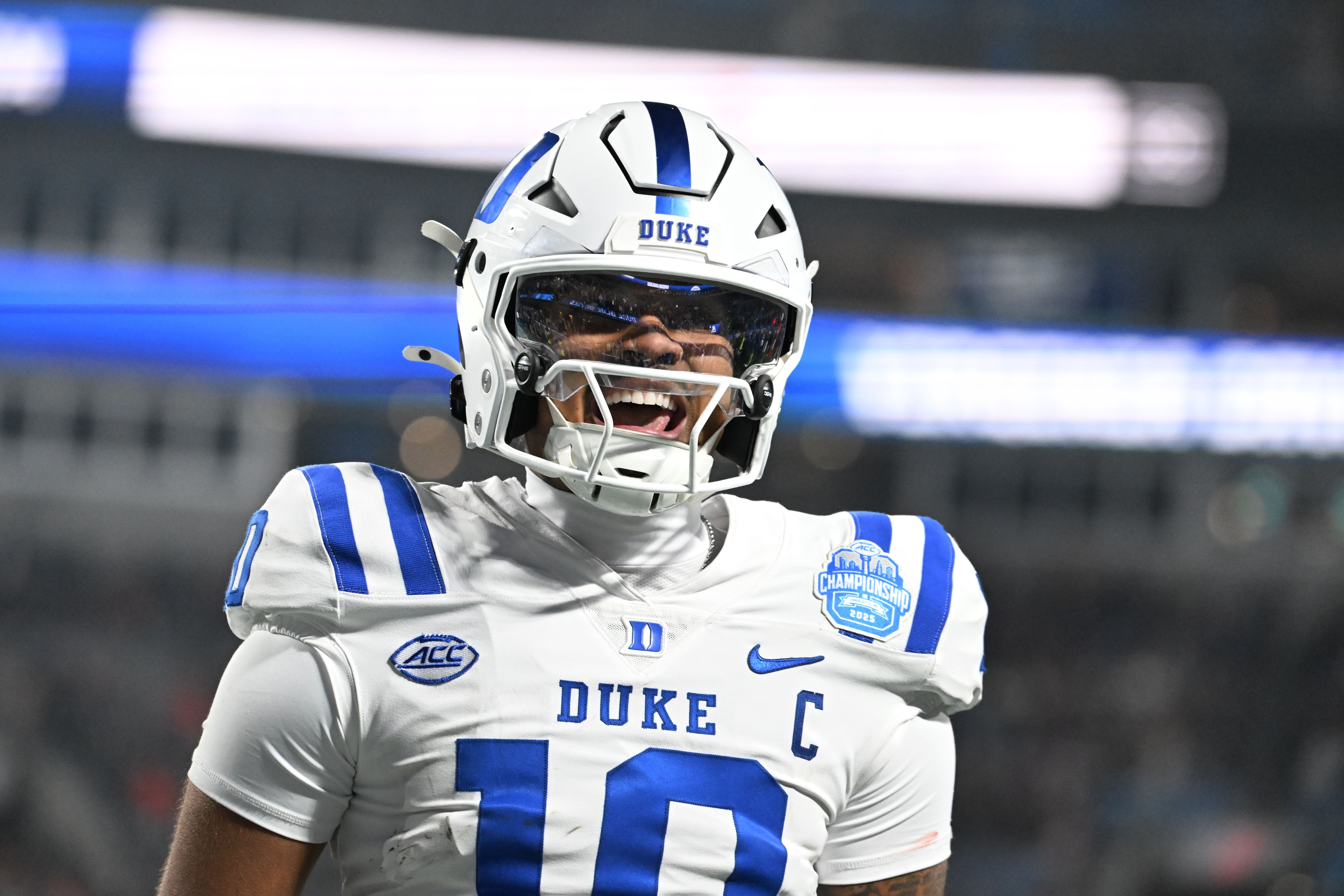 Duke Blue Devils quarterback Darian Mensah celebrates after the Blue Devils score a touchdown, and he's key as we look at our Arizona State vs. Duke predictions