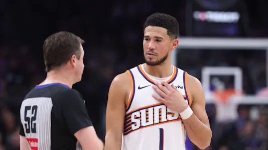 Phoenix Suns guard Devin Booker (1) speaks with a referee as we break down our Grizzlies vs. Suns player props.